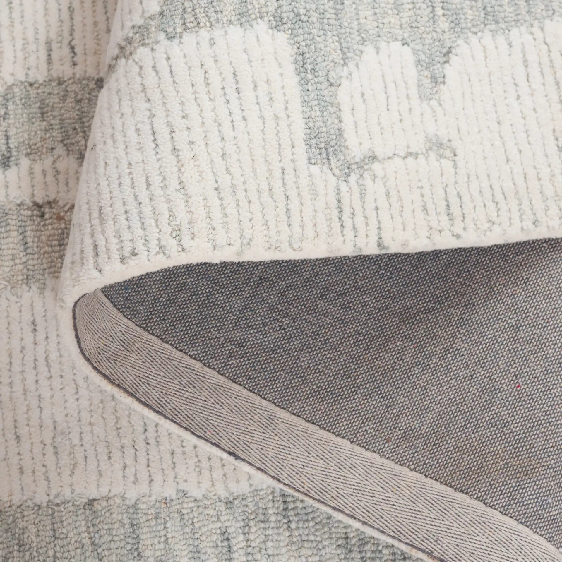Harvest Abstract Linear Hand-Tufted Wool Rug in Ivory / Light Blue in a styled room