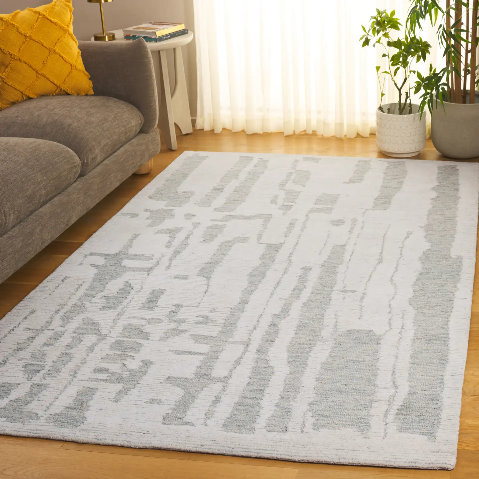 Harvest Abstract Linear Hand-Tufted Wool Rug in Ivory / Light Blue in a styled room
