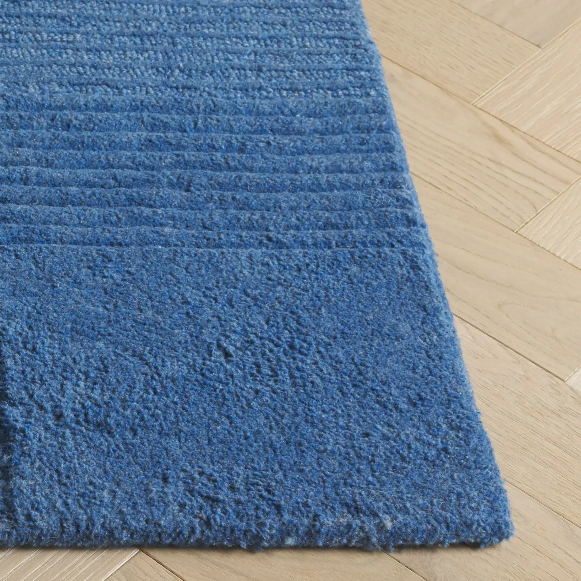 Harvest Abstract Block Hand-Tufted Rug in Blue in a styled room