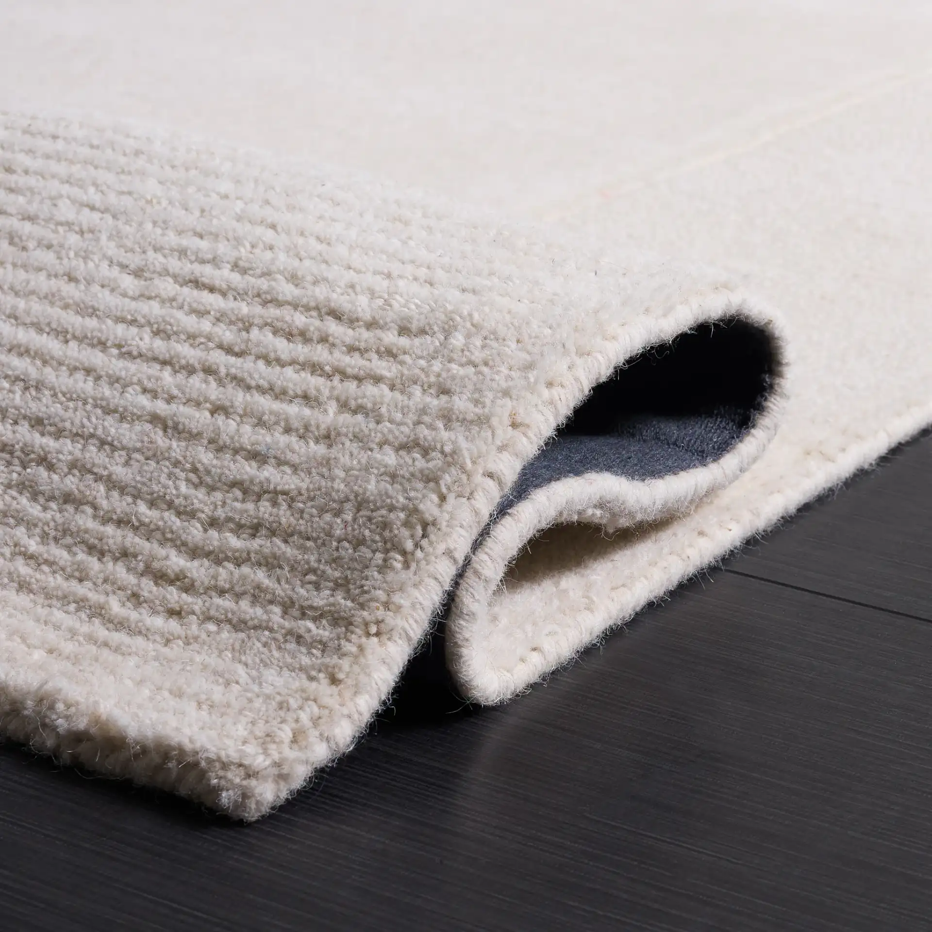 Harvest Ribbed Border Hand-Tufted Wool Rug in Ivory in a styled room