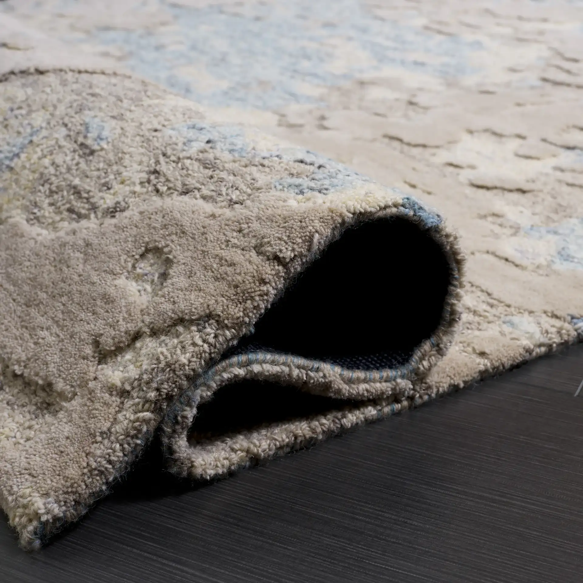 Harvest Abstract Textured Hand-Tufted Wool Rug in Taupe / Blue in a styled room