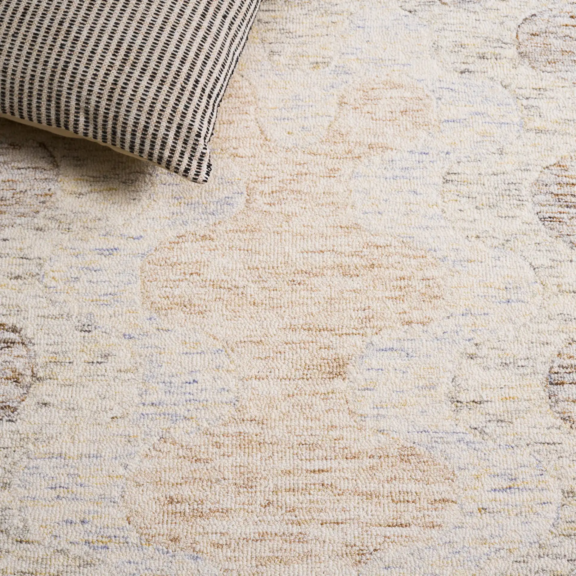 Harvest Scalloped Border Hand-Tufted Wool Rug in Beige / Brown in a styled room