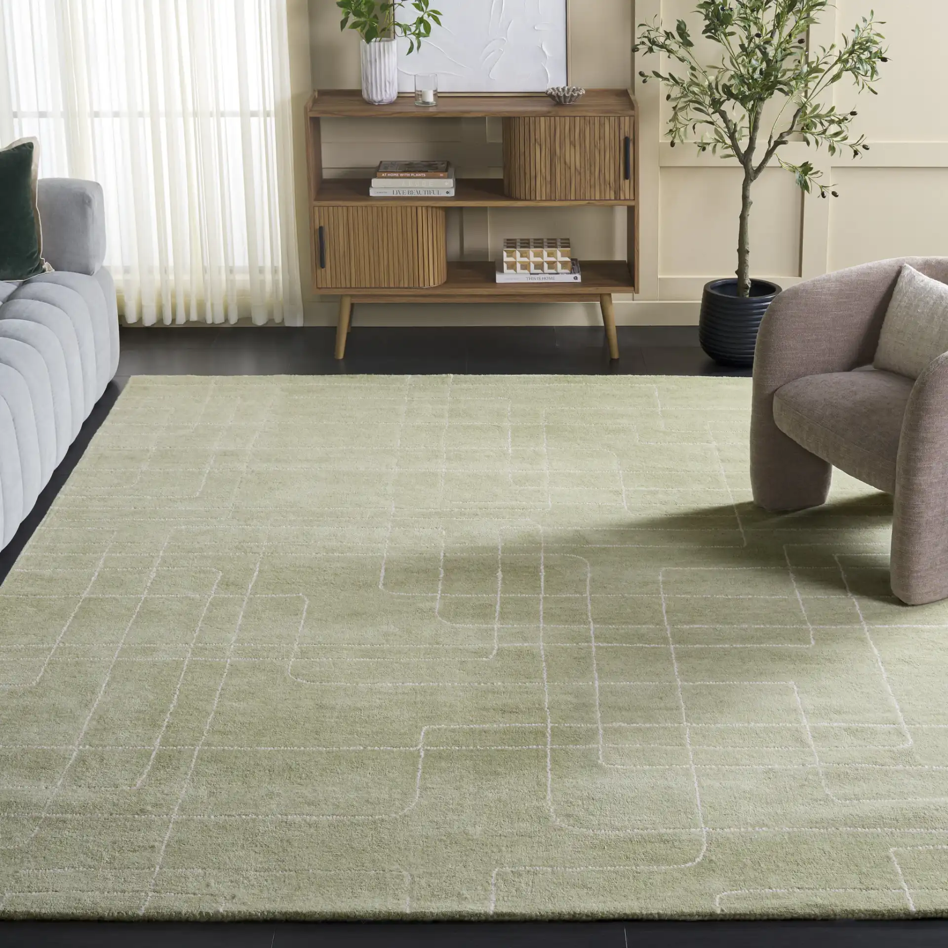 Harvest Dotted Line Hand-Tufted Wool Rug in Sage in a styled room