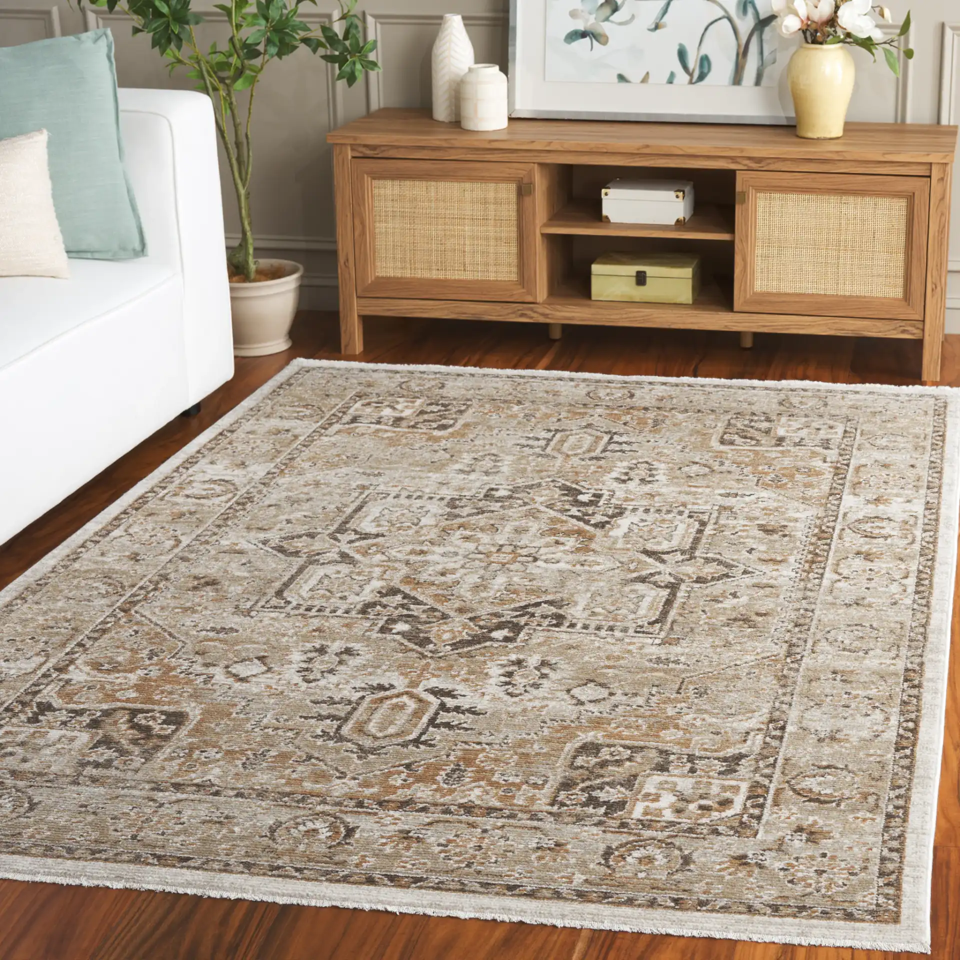 Hazel Medallion Bordered Rug in Beige / Brown in a styled room