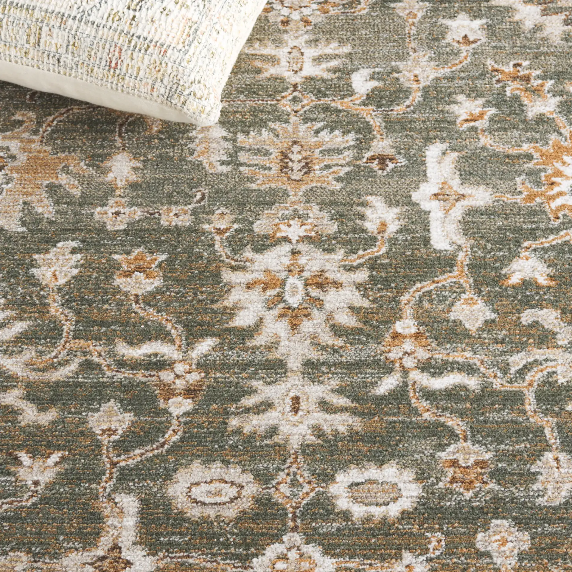 Hazel Botanical Bordered Rug in Green / Ivory in a styled room