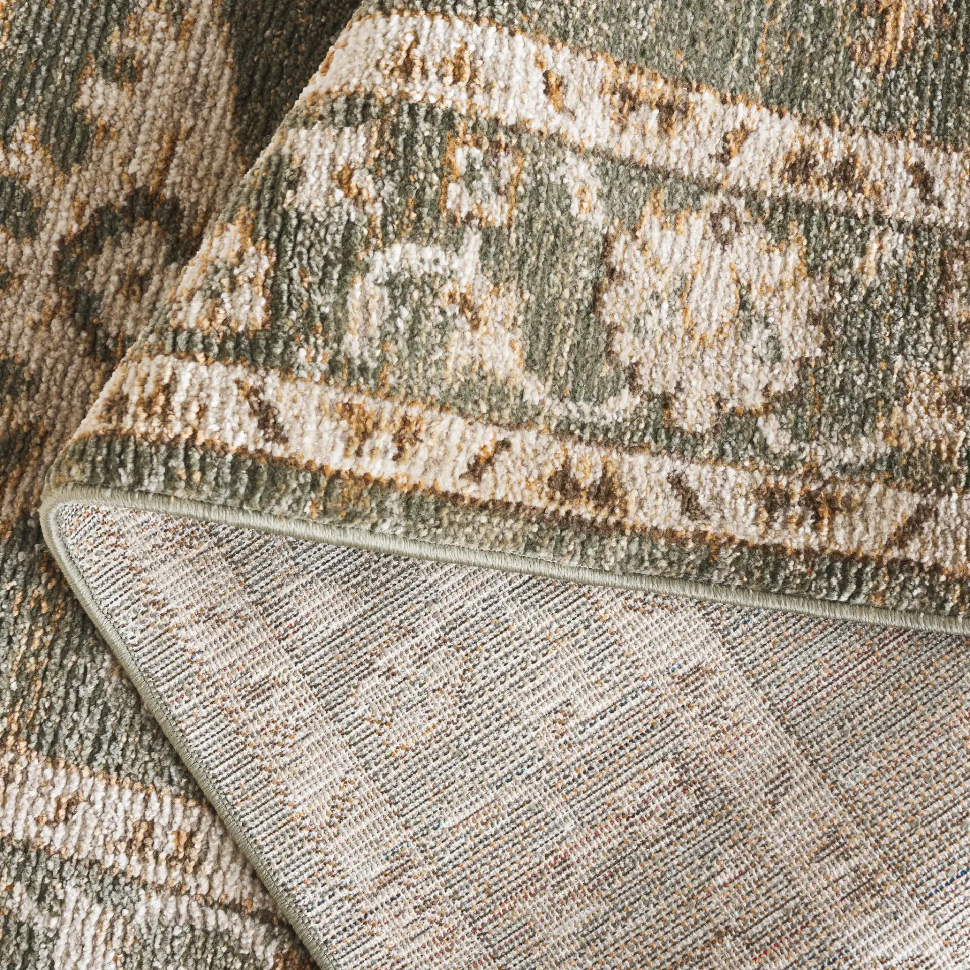 Hazel Botanical Bordered Rug in Green / Ivory in a styled room