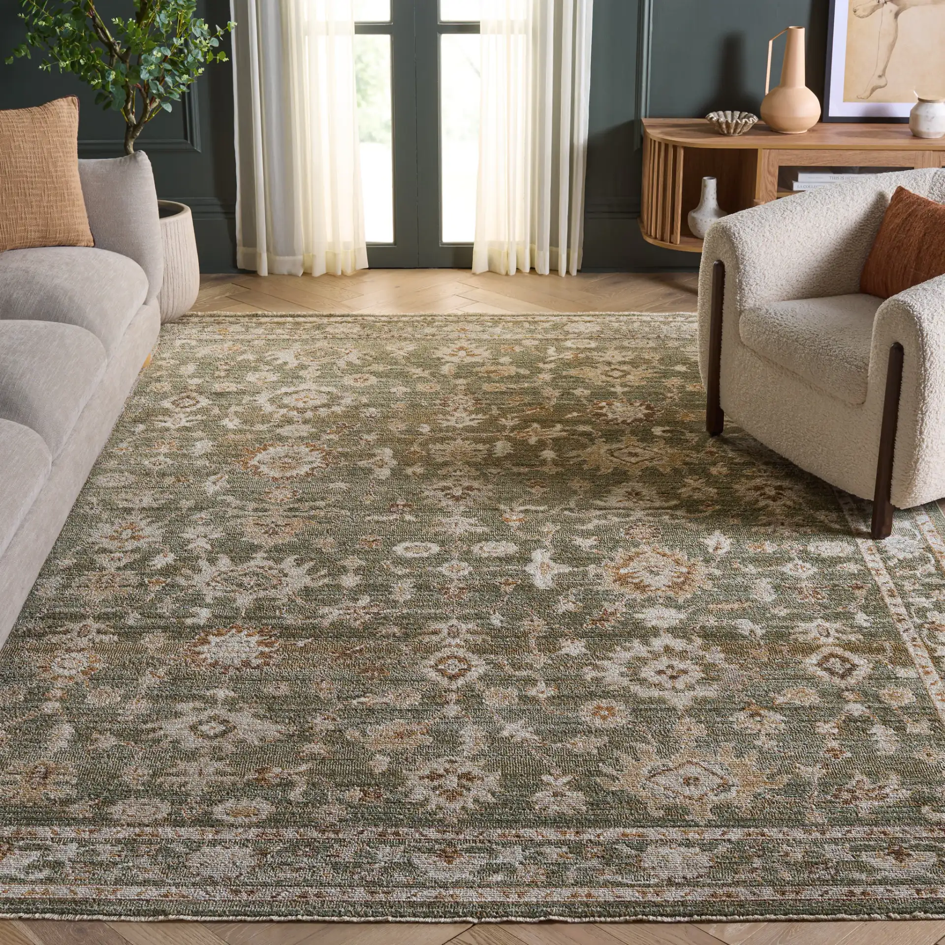 Hazel Botanical Bordered Rug in Green / Ivory in a styled room