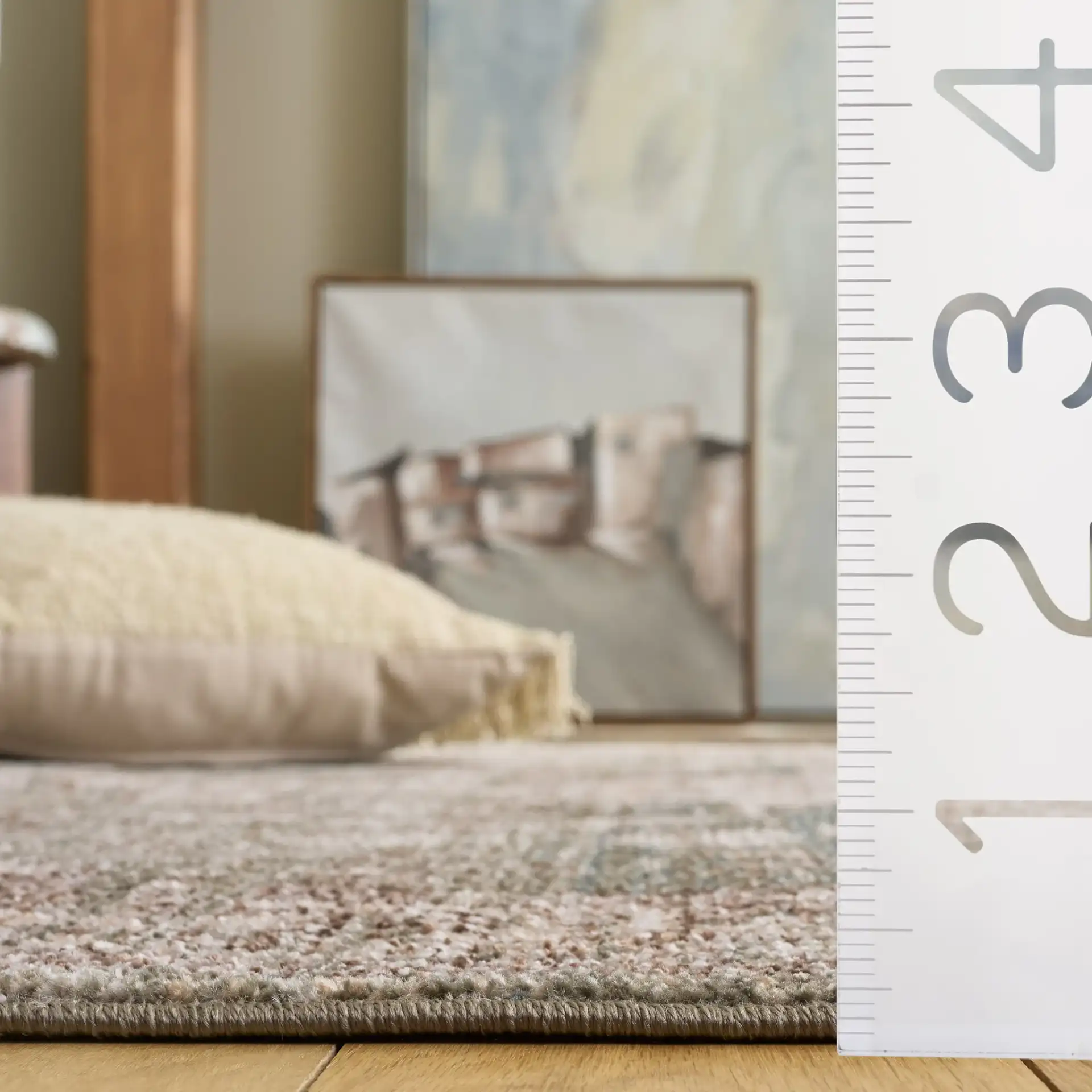 Hazel Distressed Medallion Rug in Green / Beige in a styled room