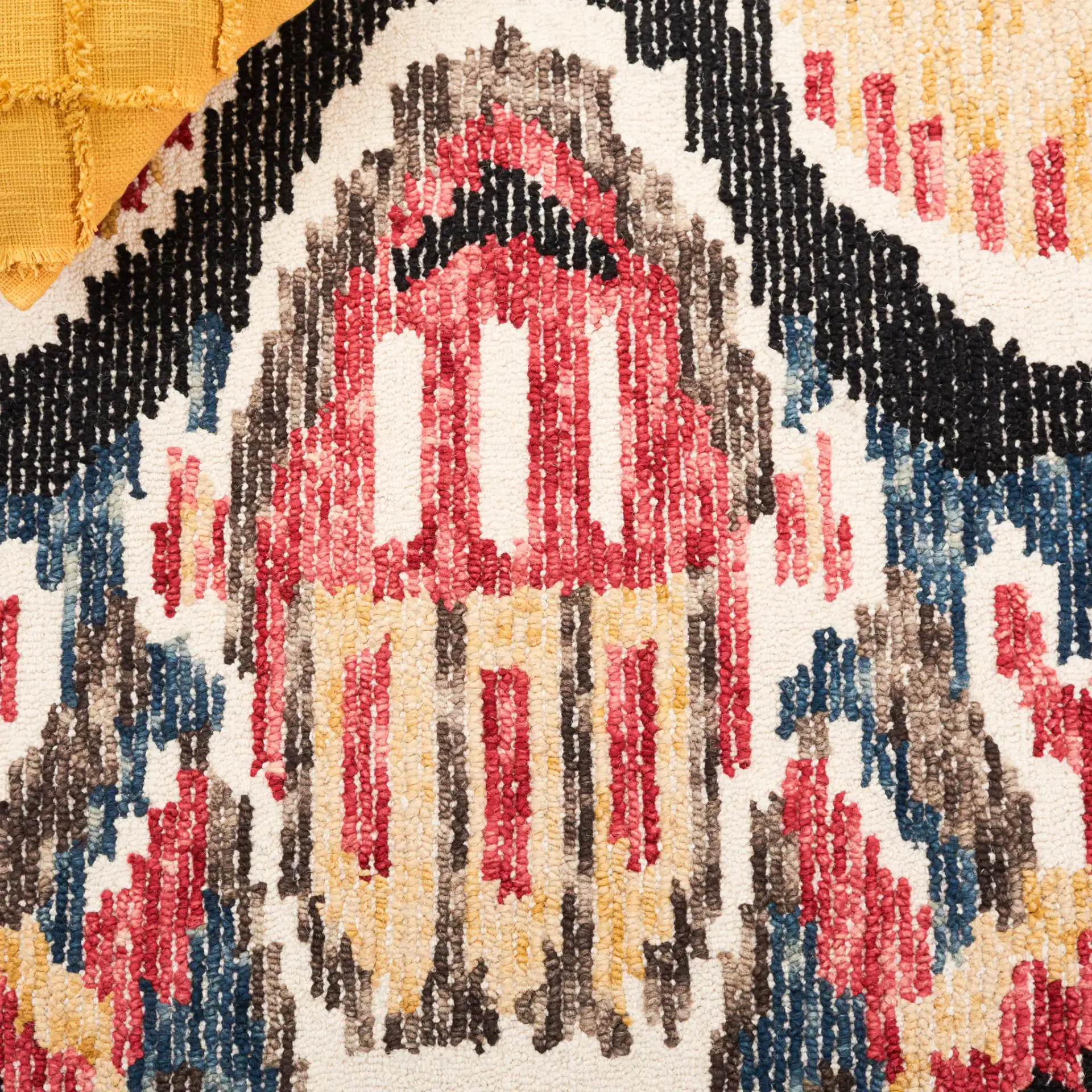Ikat Bohemian Feathered Wave Hand-Tufted Wool Rug in Black / Red in a styled room