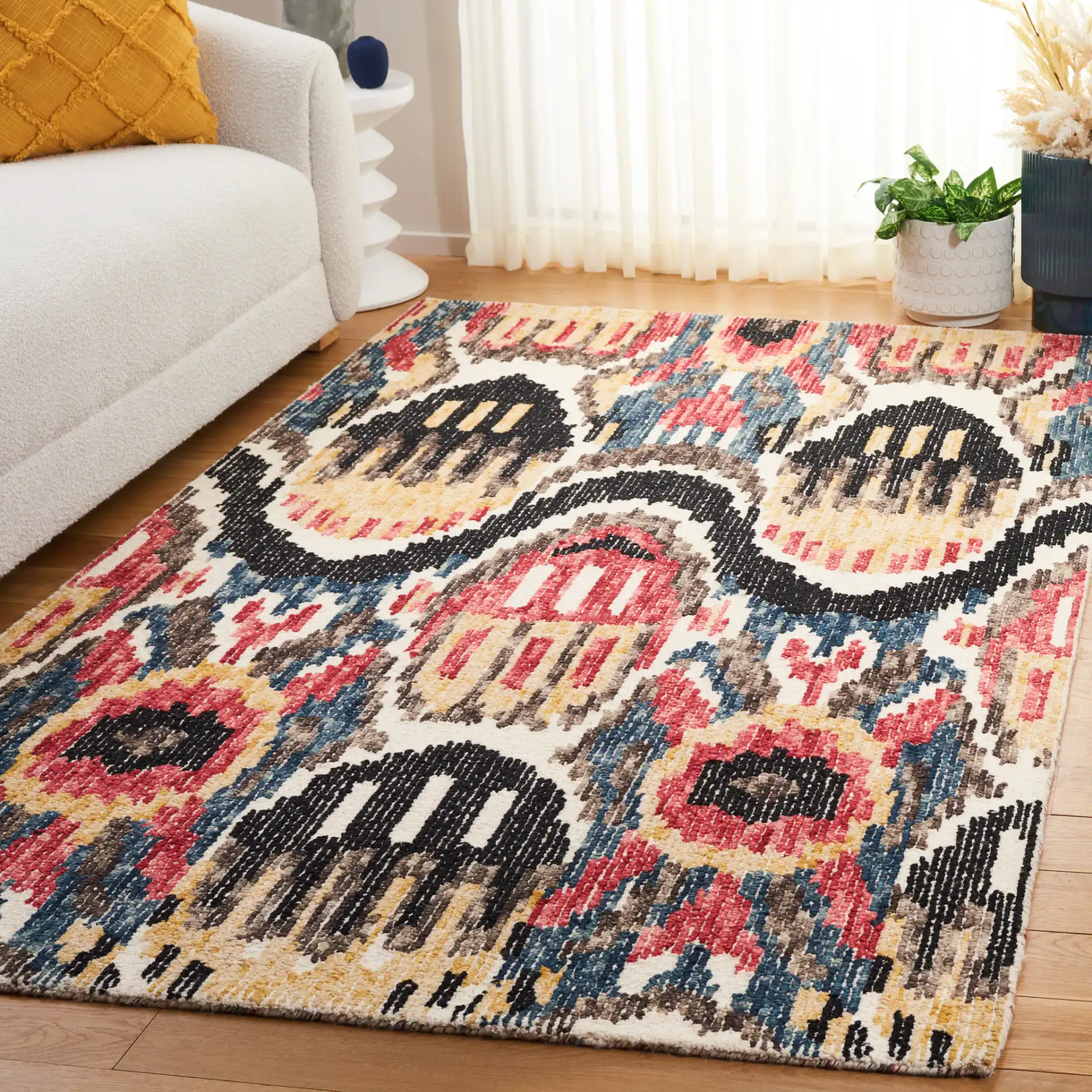 Ikat Bohemian Feathered Wave Hand-Tufted Wool Rug in Black / Red in a styled room