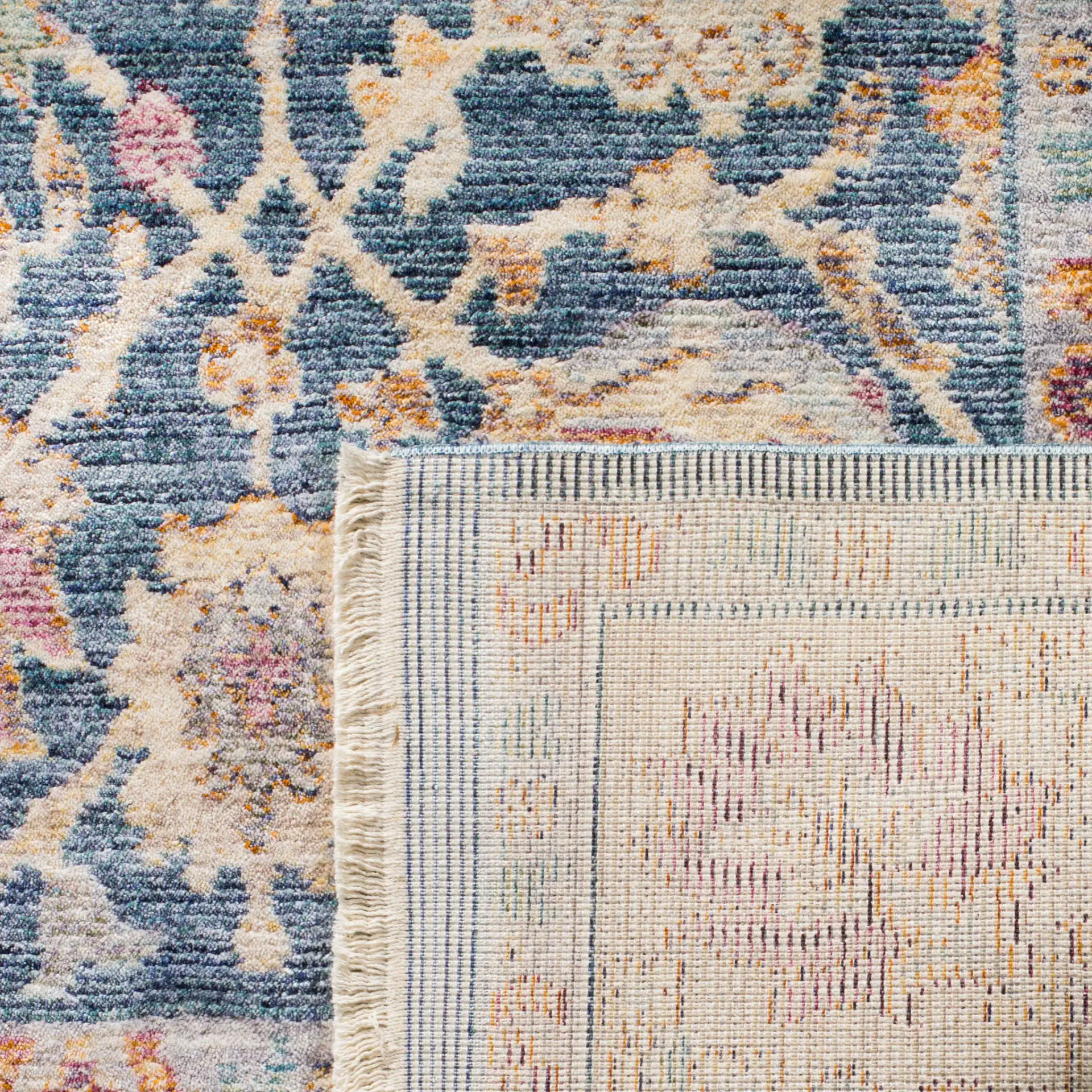 Illusion Floral Bordered Rug in Blue / Cream in a styled room
