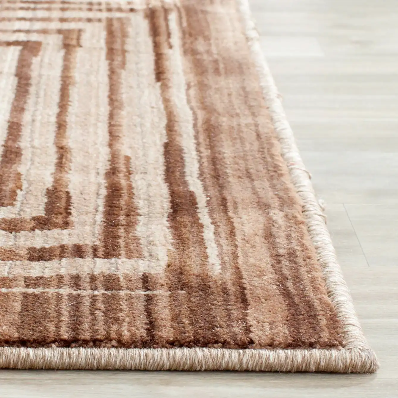 Infinity Concentric Square Rug in Brown / Beige in a styled room
