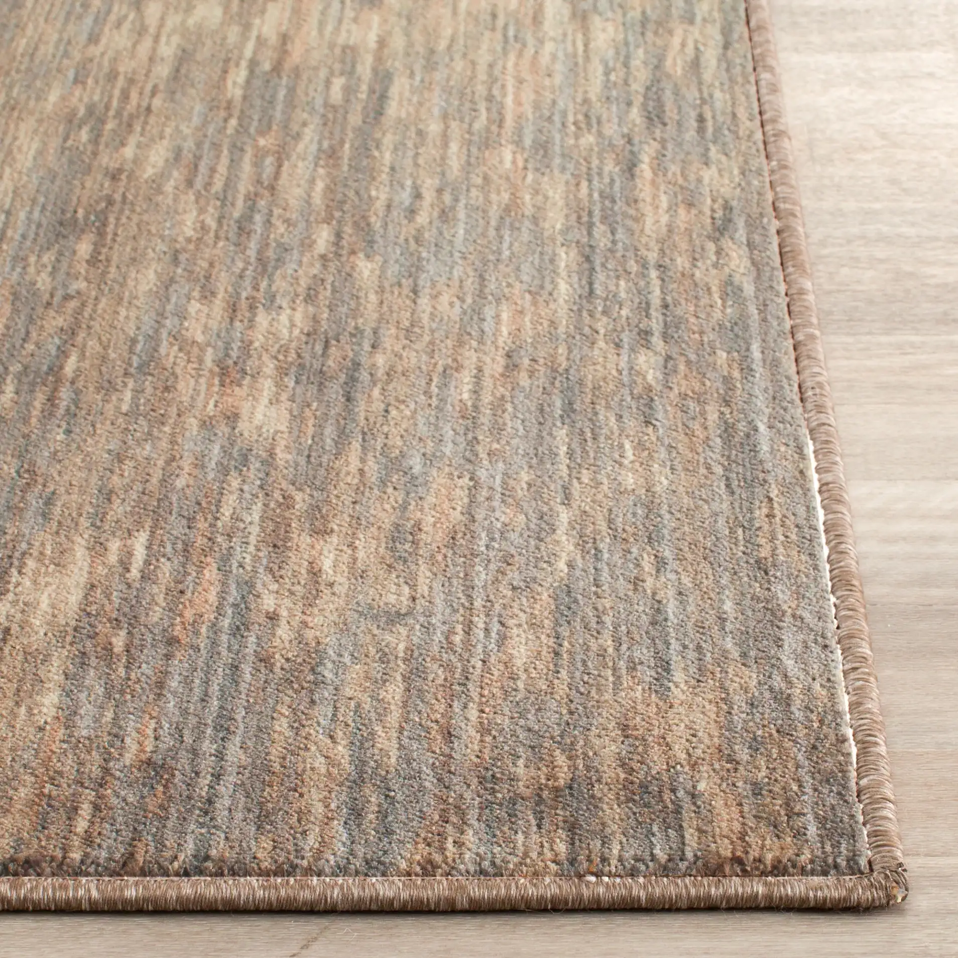 Infinity Striated Abstract Rug in Beige / Gray in a styled room