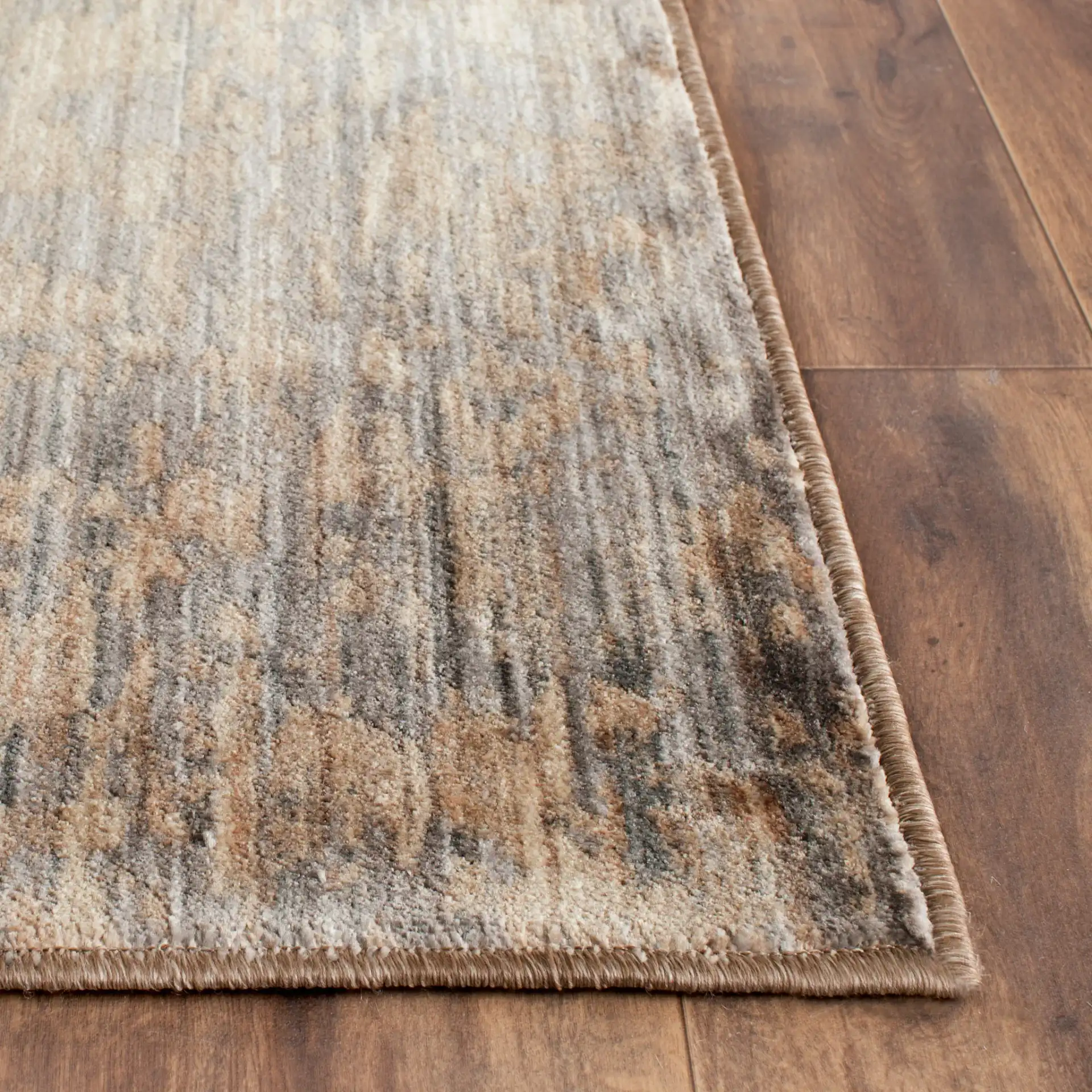 Infinity Striated Abstract Rug in Beige / Gray in a styled room