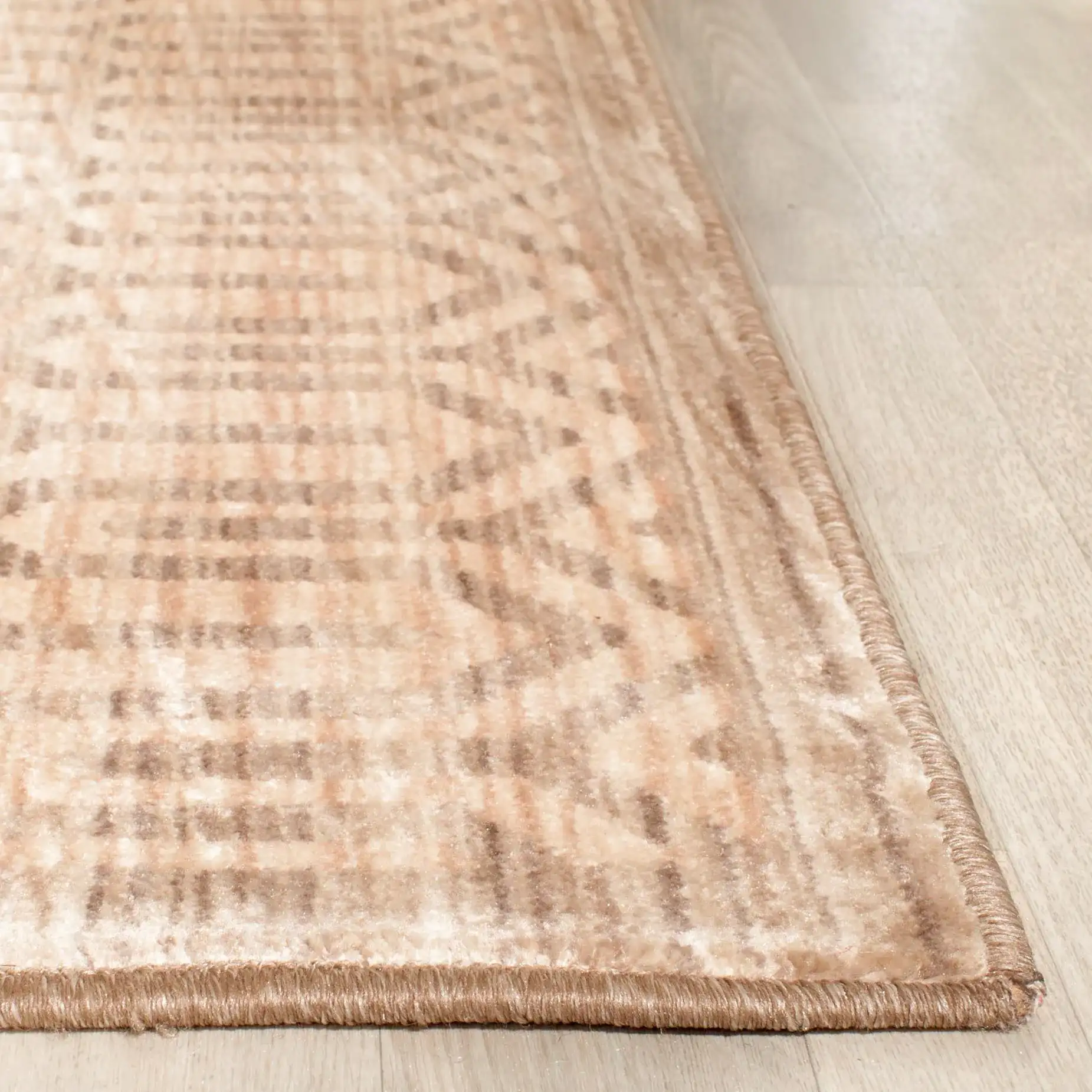 Infinity Chevron Stripe Rug in Beige / Taupe in a styled room