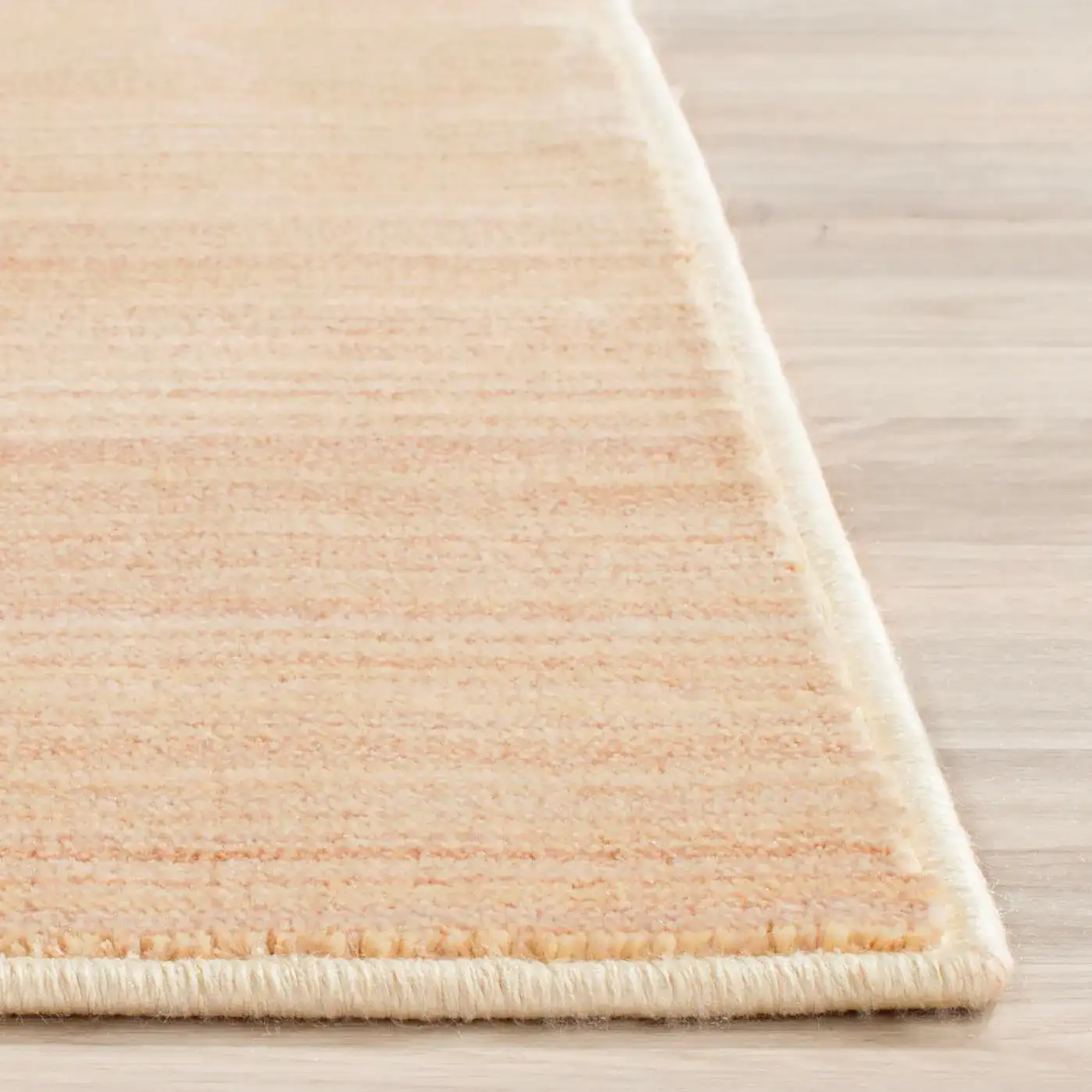 Infinity Striated Stripe Rug in Beige / Yellow in a styled room