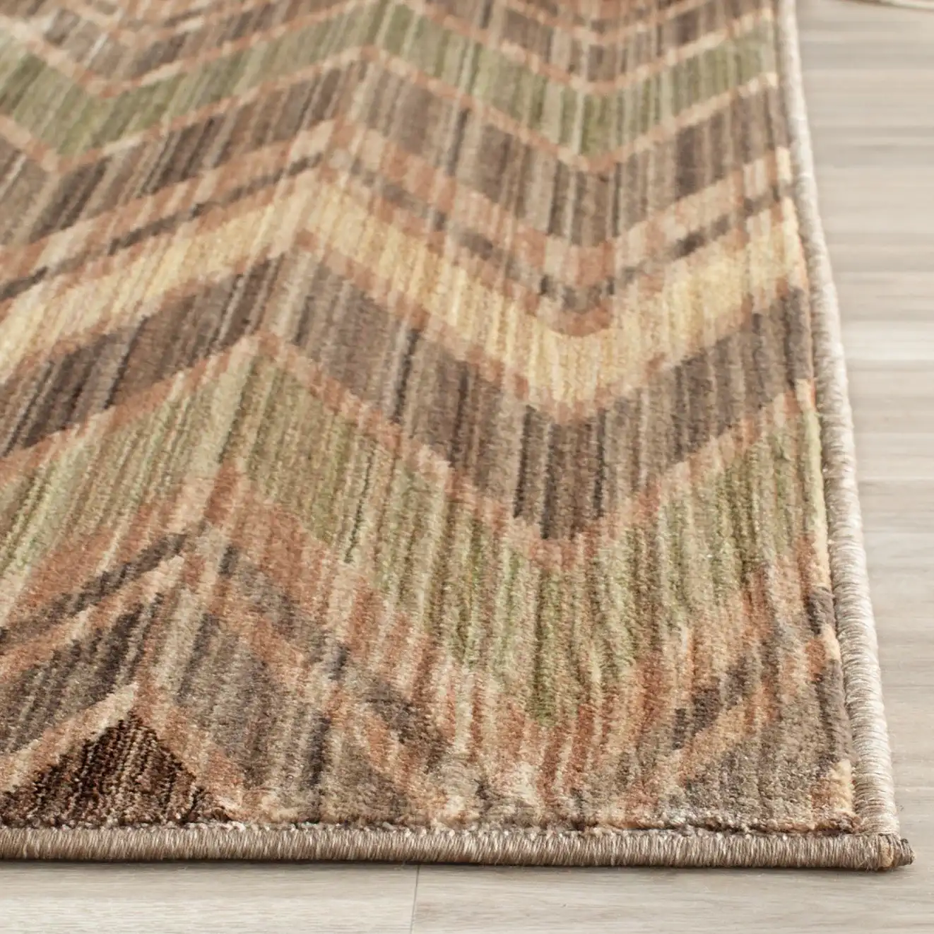 Infinity Chevron Rug in Taupe / Beige in a styled room