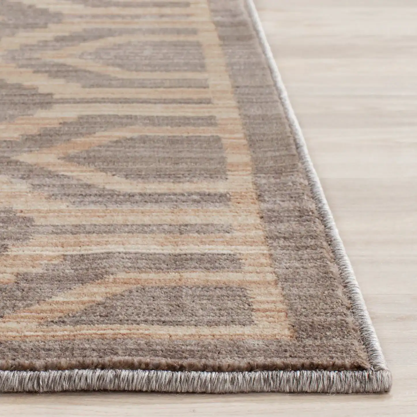 Infinity Concentric Hexagon Rug in Gray / Beige in a styled room
