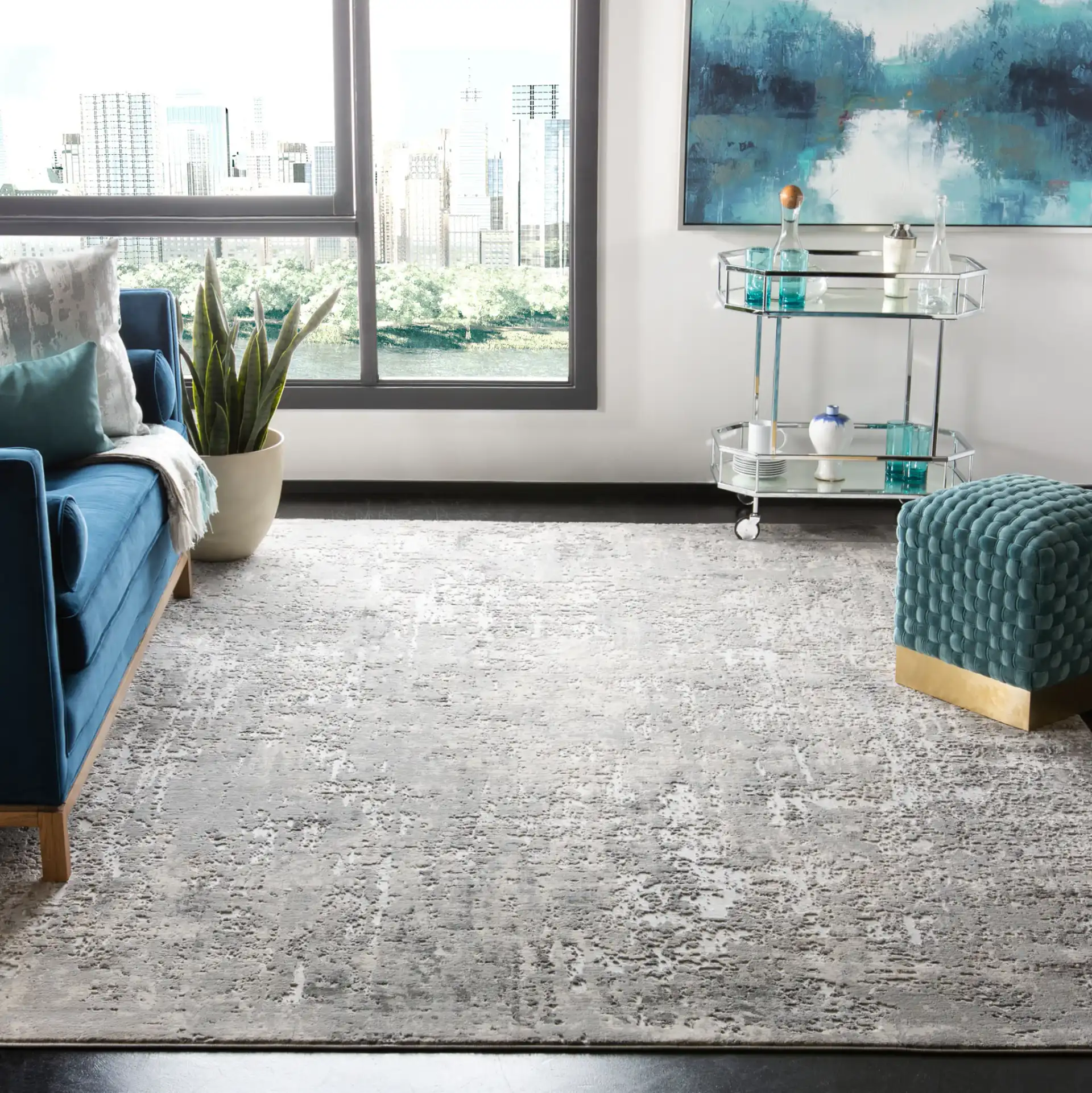 Invista Distressed Abstract Rug in Gray / Ivory in a styled room