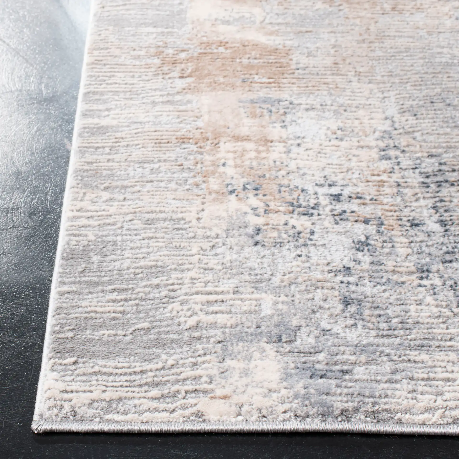 Invista Linear Abstract Rug in Cream / Gray in a styled room