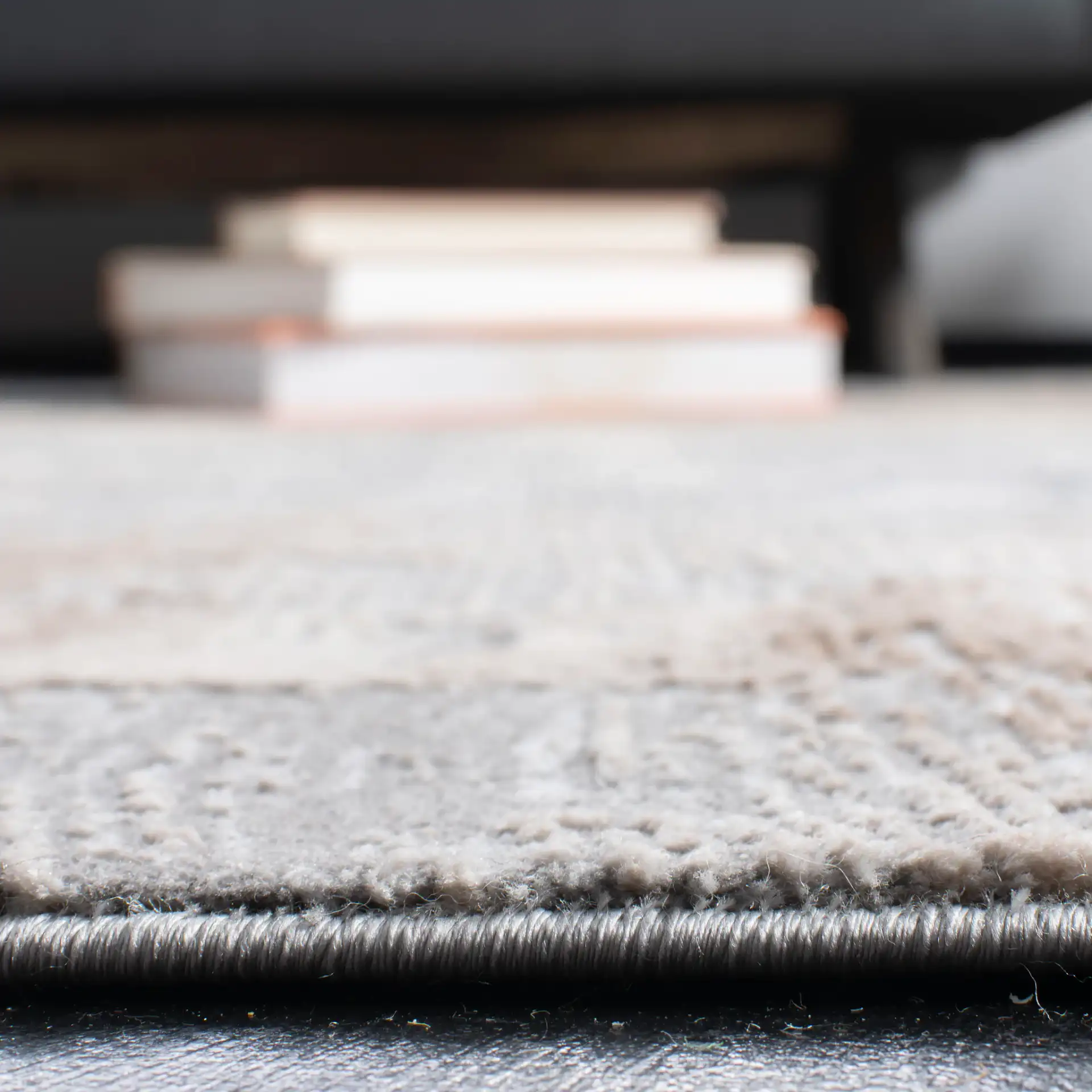 Invista Linear Abstract Rug in Cream / Gray in a styled room
