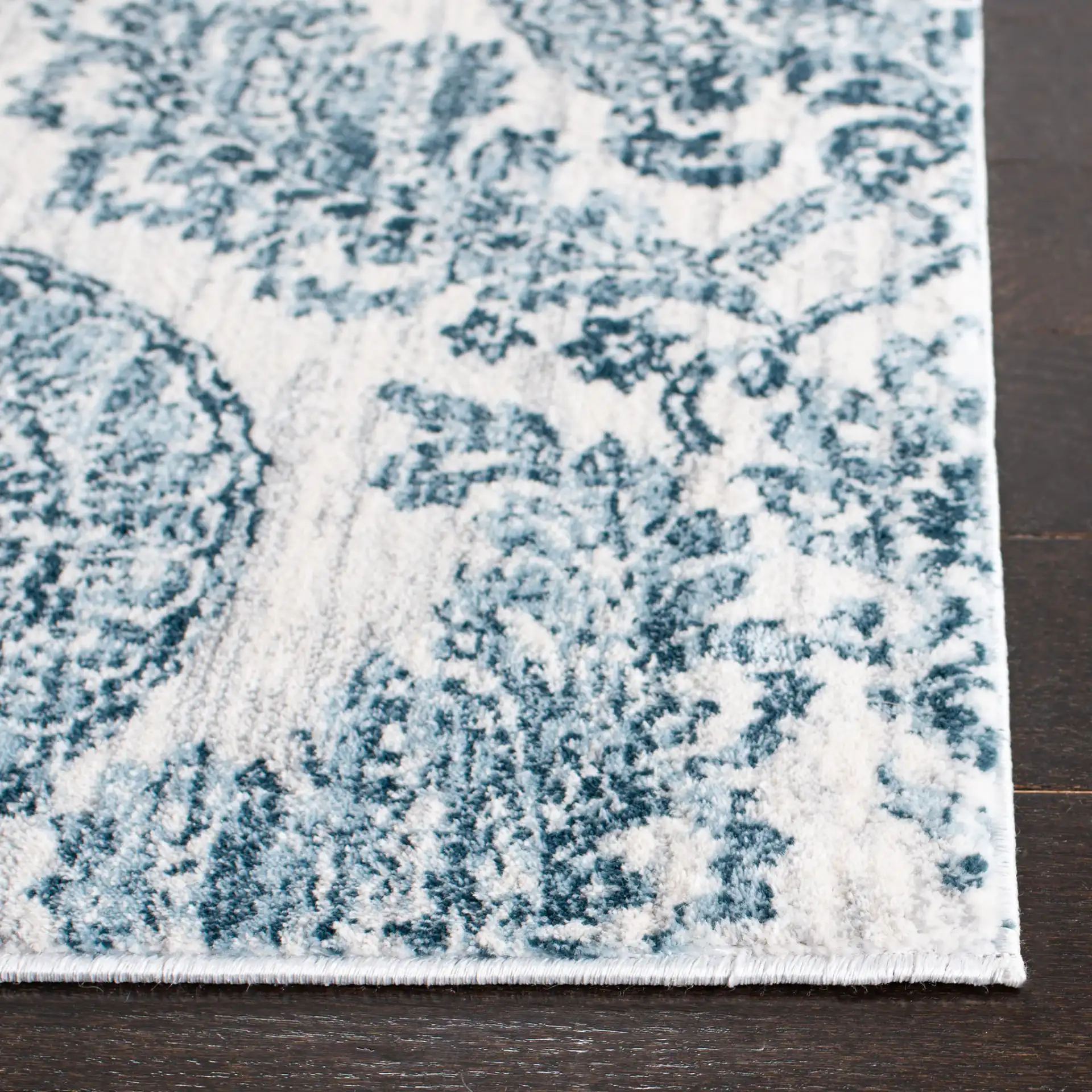 Isabella Damask Rug in Navy / Ivory in a styled room