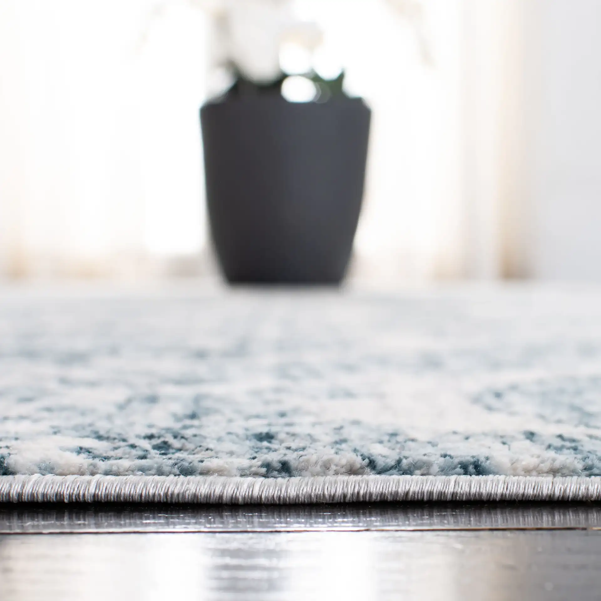 Isabella Damask Rug in Navy / Ivory in a styled room