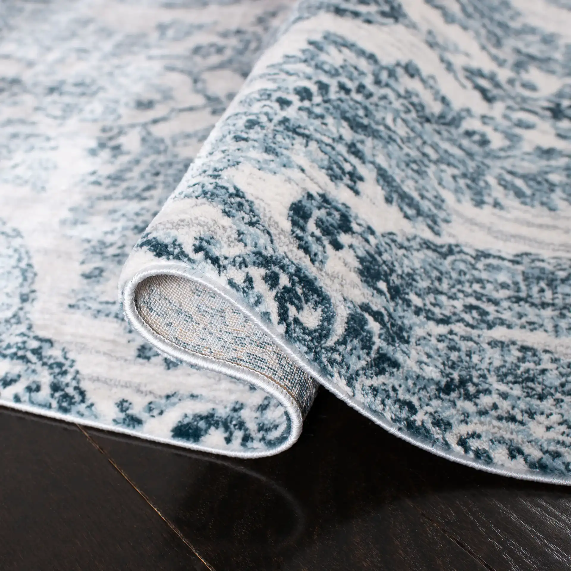 Isabella Damask Rug in Navy / Ivory in a styled room