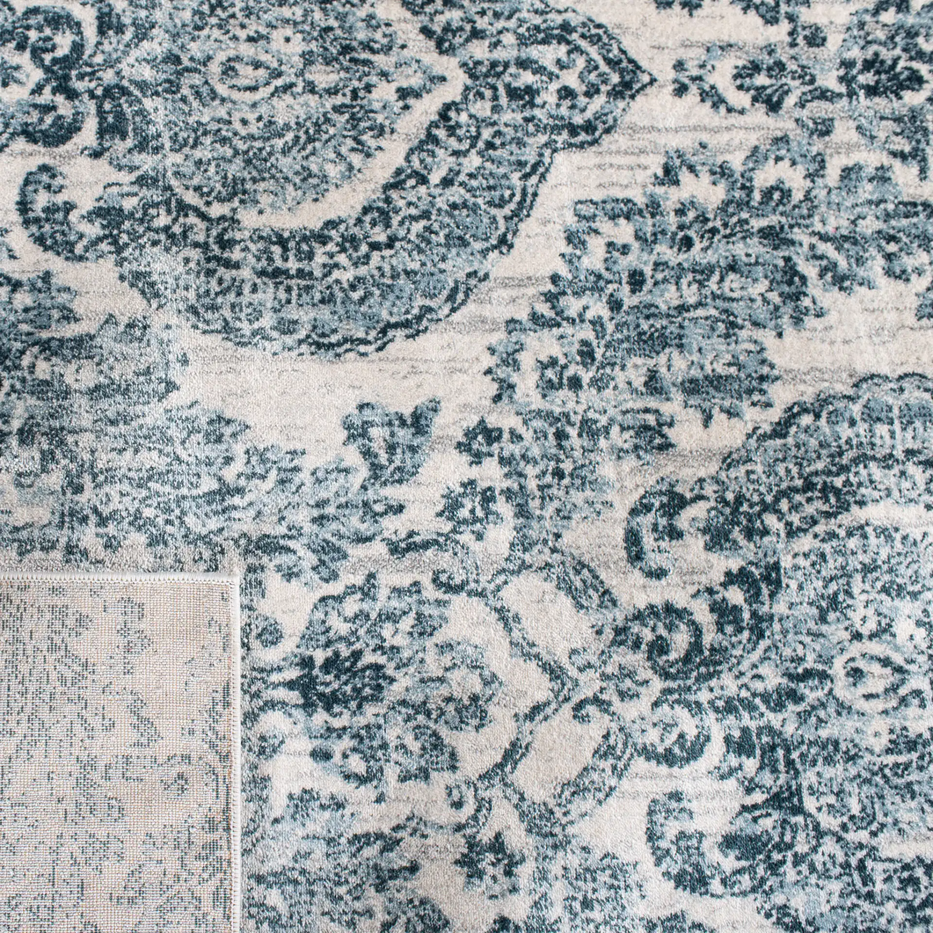 Isabella Damask Rug in Navy / Ivory in a styled room