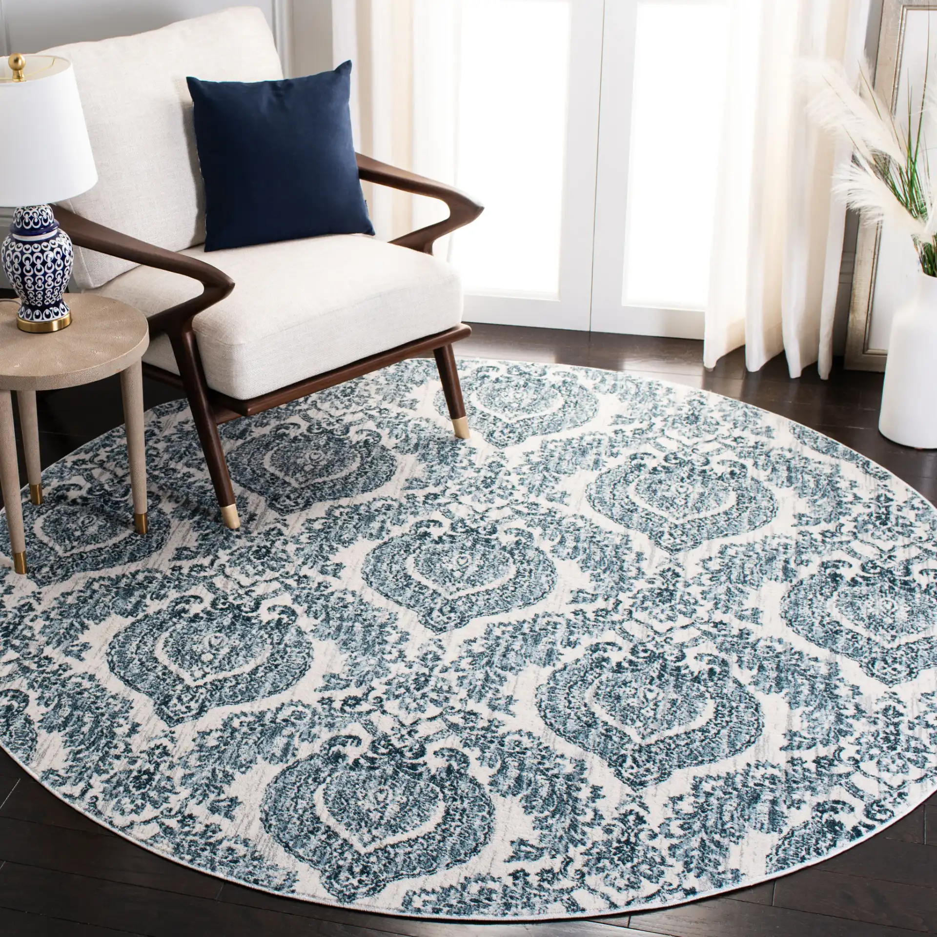 Isabella Damask Rug in Navy / Ivory in a styled room
