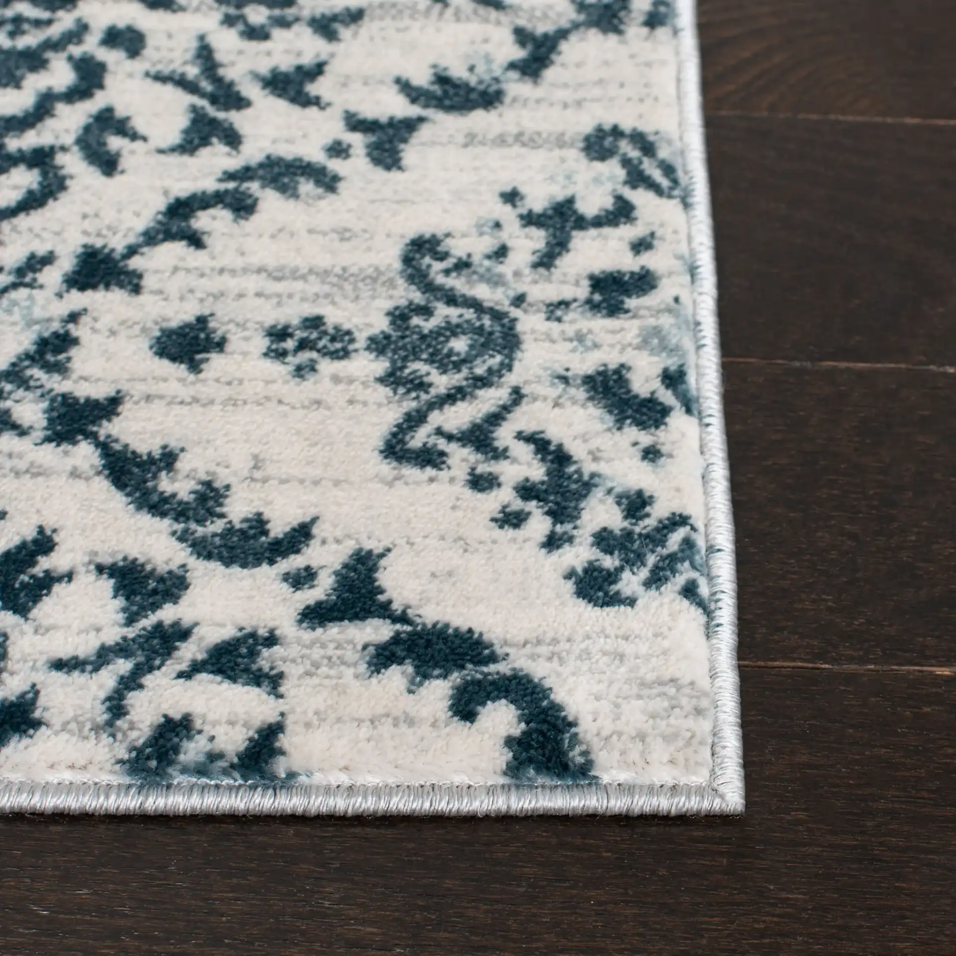 Isabella Floral Trellis Rug in Navy / Ivory in a styled room