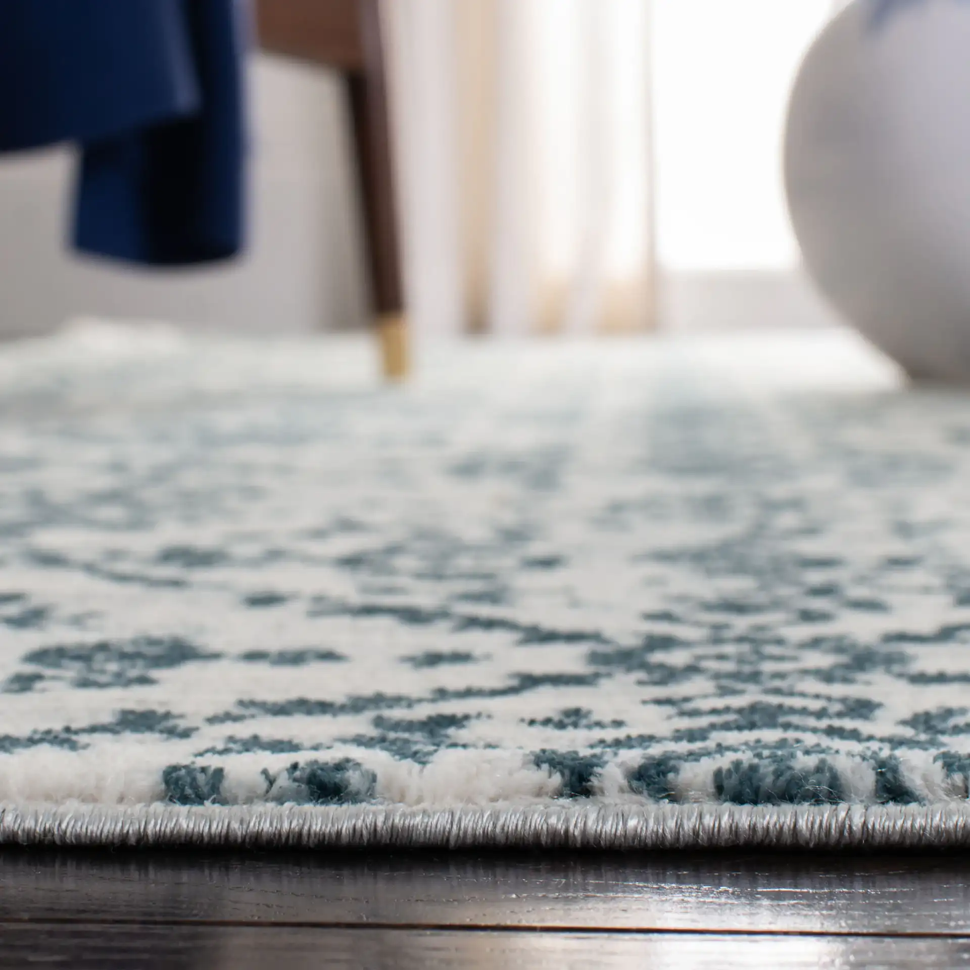 Isabella Floral Trellis Rug in Navy / Ivory in a styled room