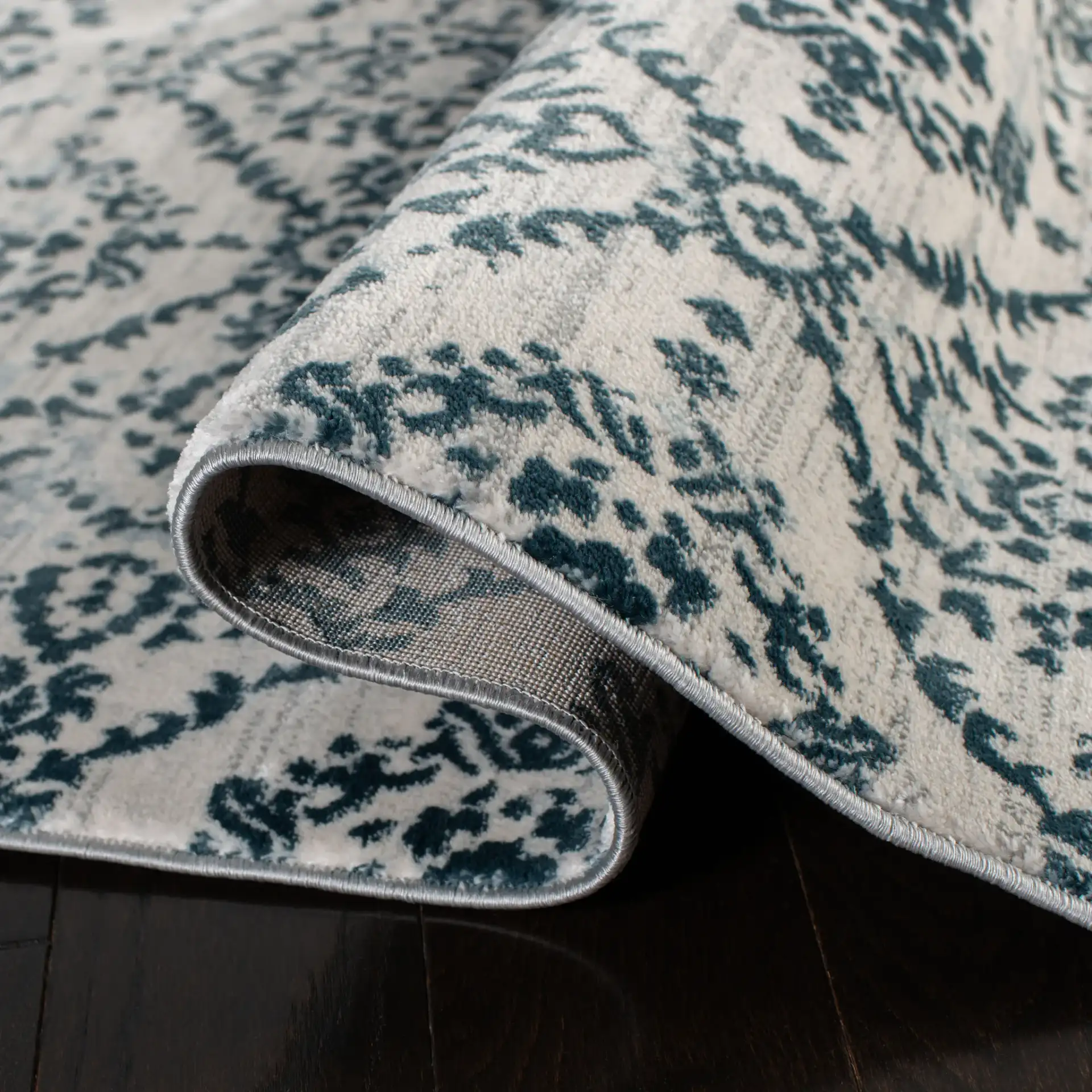 Isabella Floral Trellis Rug in Navy / Ivory in a styled room