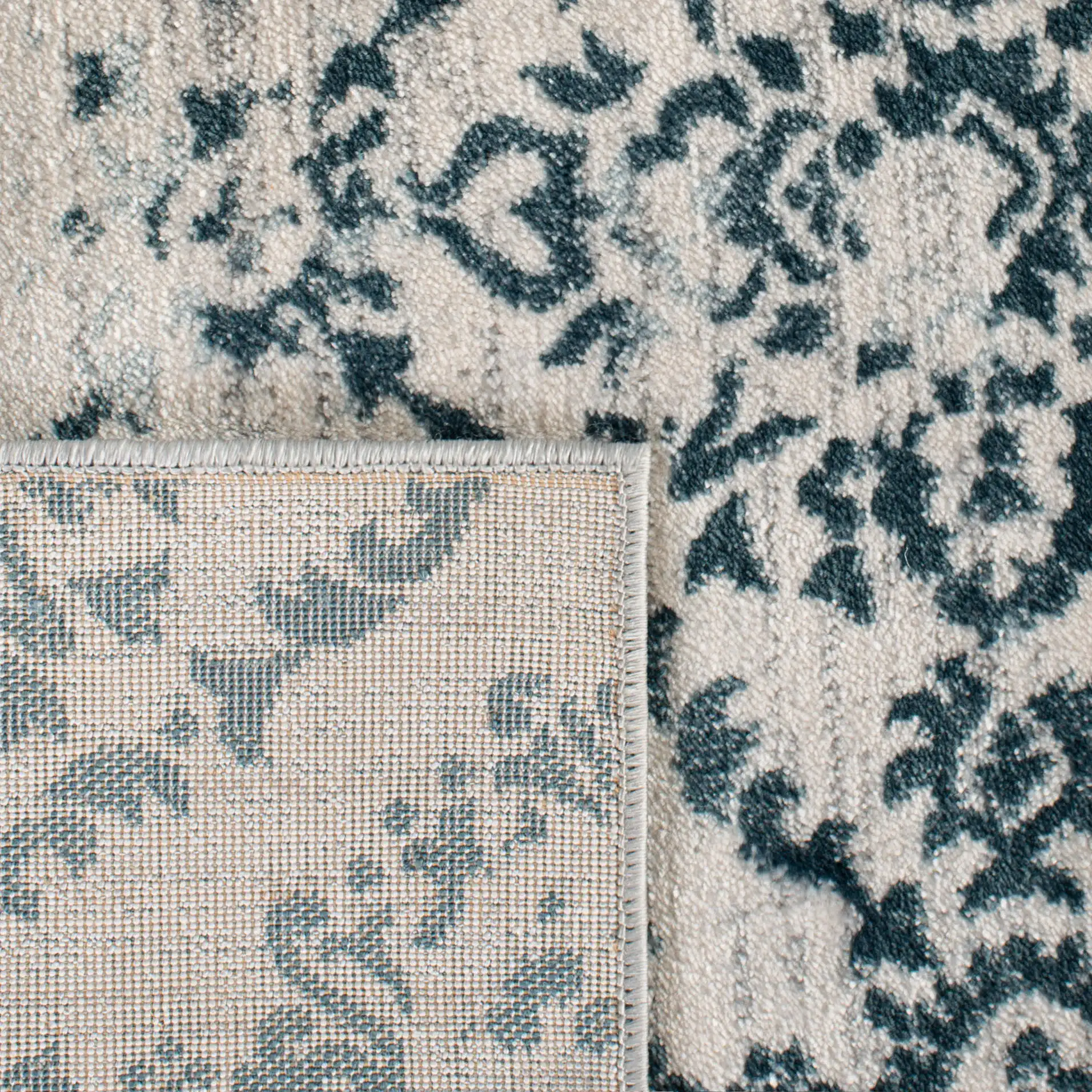 Isabella Floral Trellis Rug in Navy / Ivory in a styled room