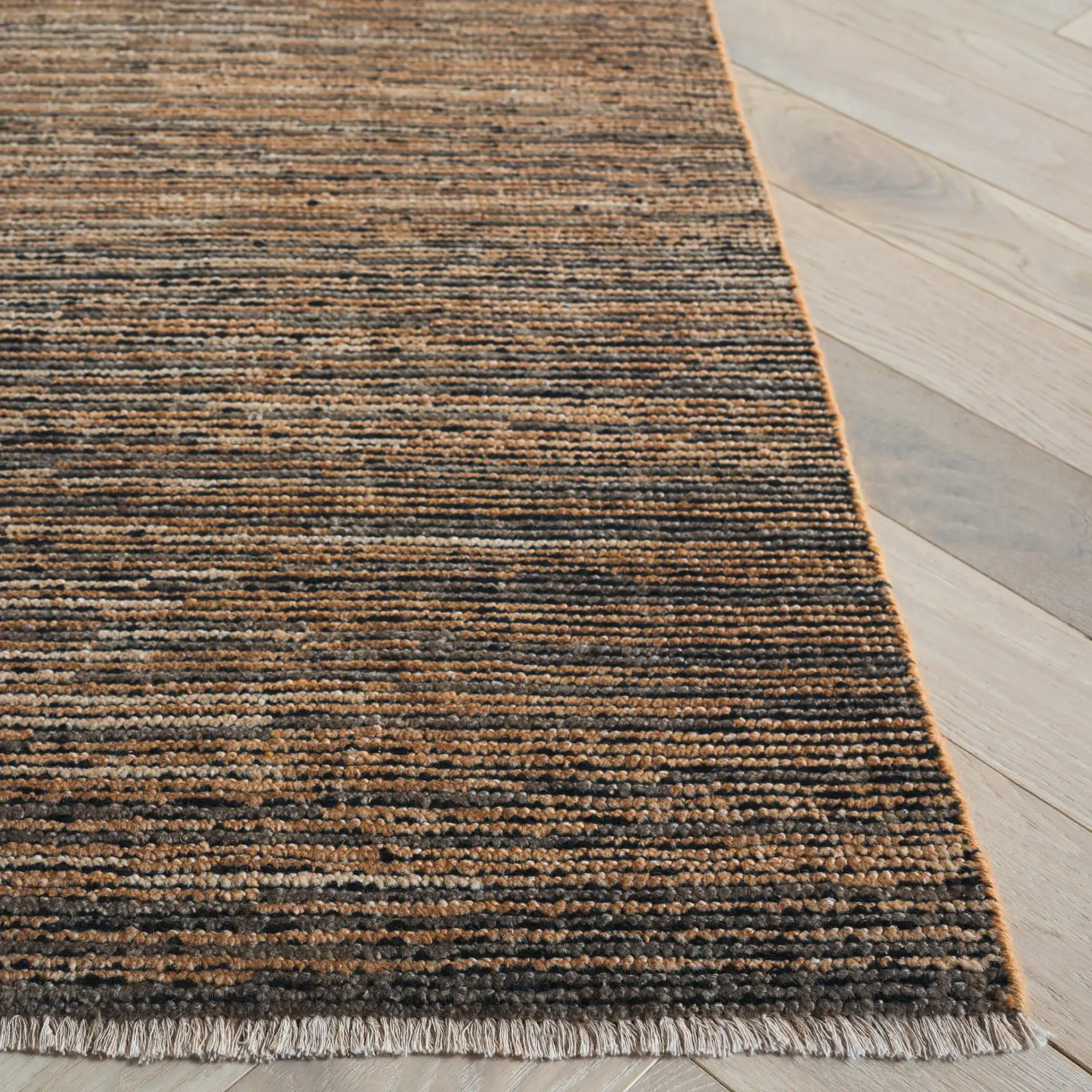 Izmir Striated Hand-Knotted Rug in Brown / Gray in a styled room