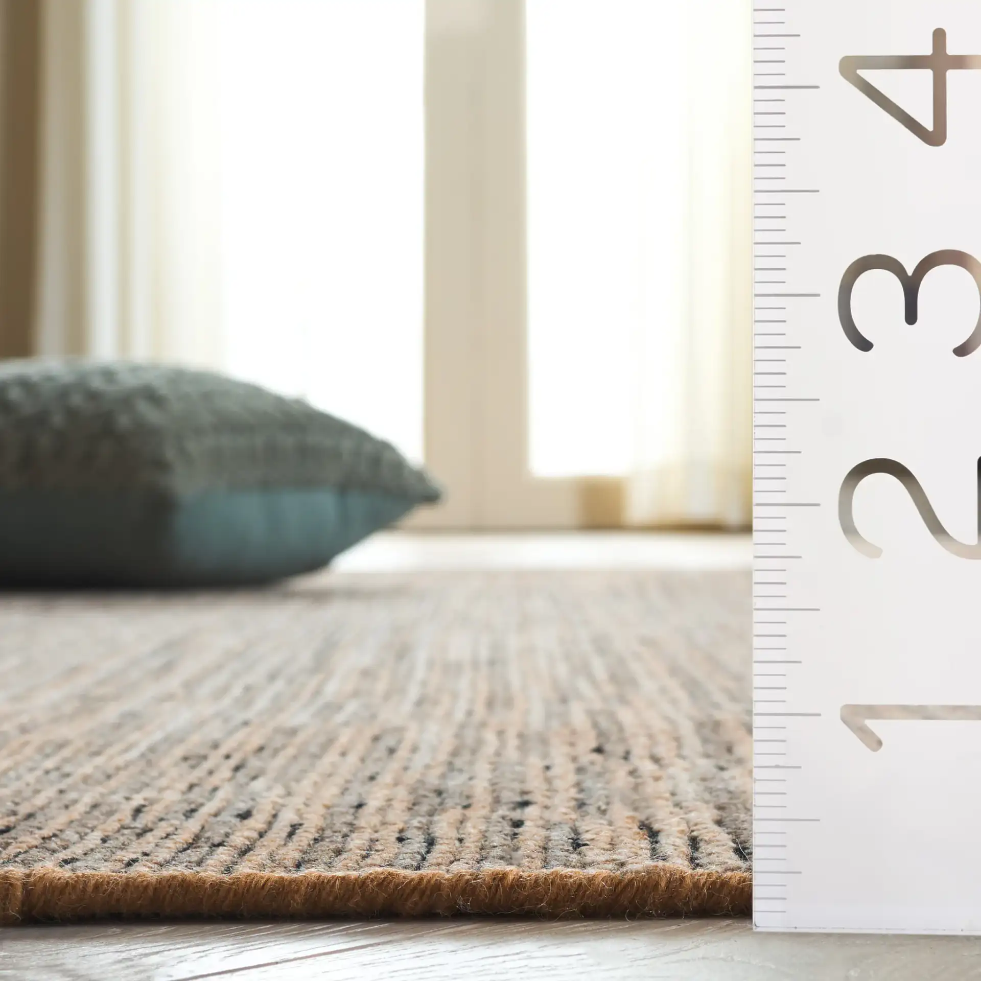 Izmir Striated Hand-Knotted Rug in Brown / Gray in a styled room
