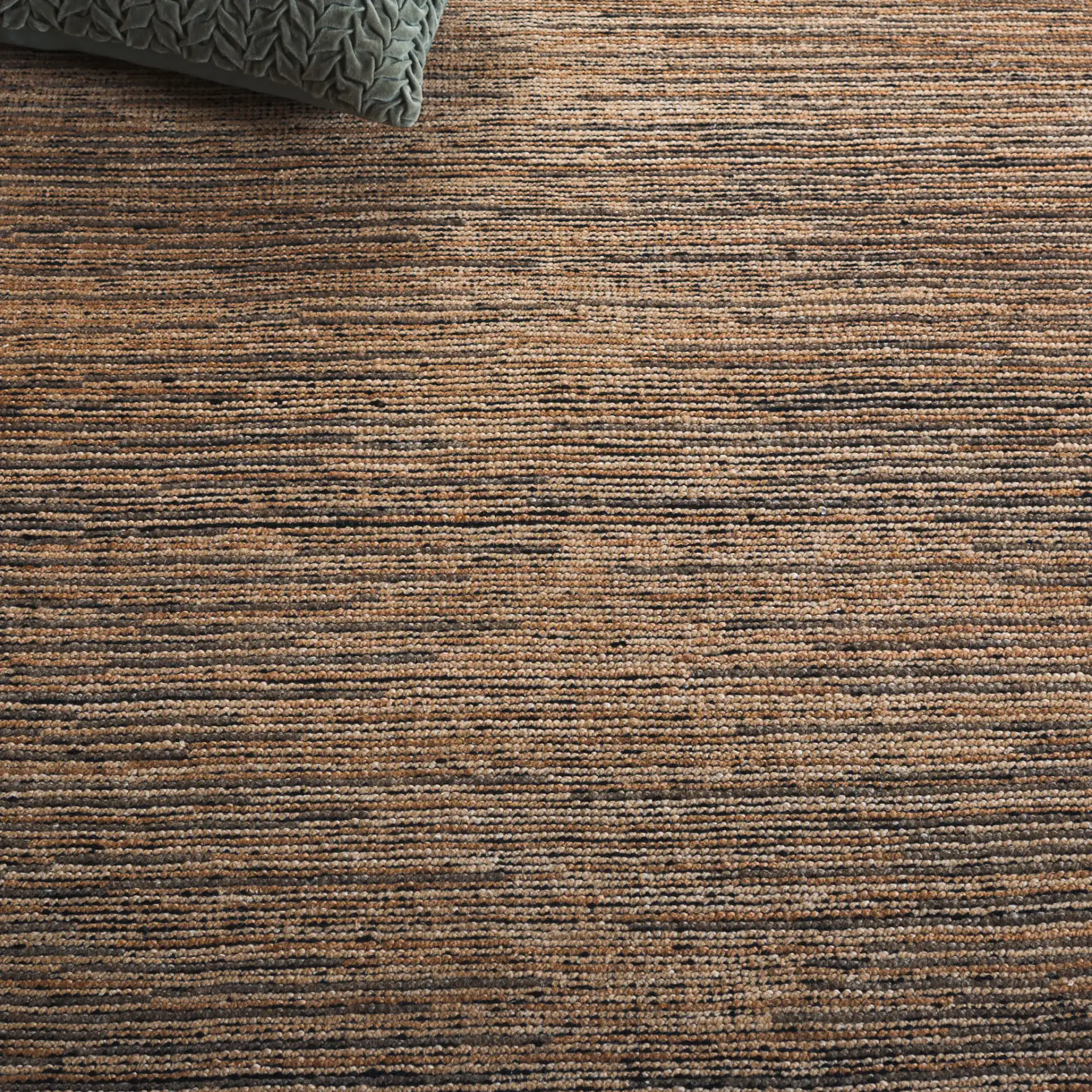 Izmir Striated Hand-Knotted Rug in Brown / Gray in a styled room