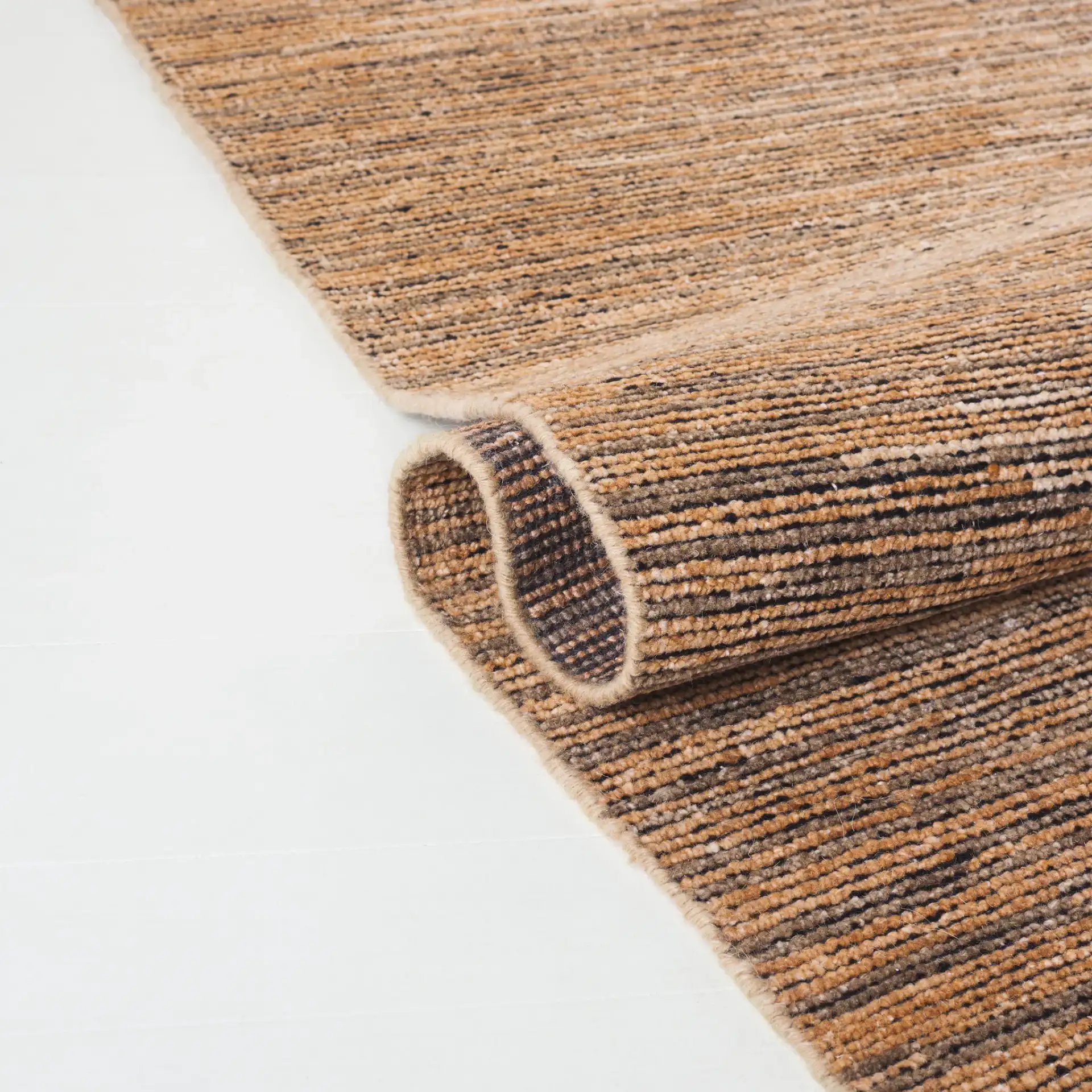 Izmir Striated Hand-Knotted Rug in Brown / Gray in a styled room