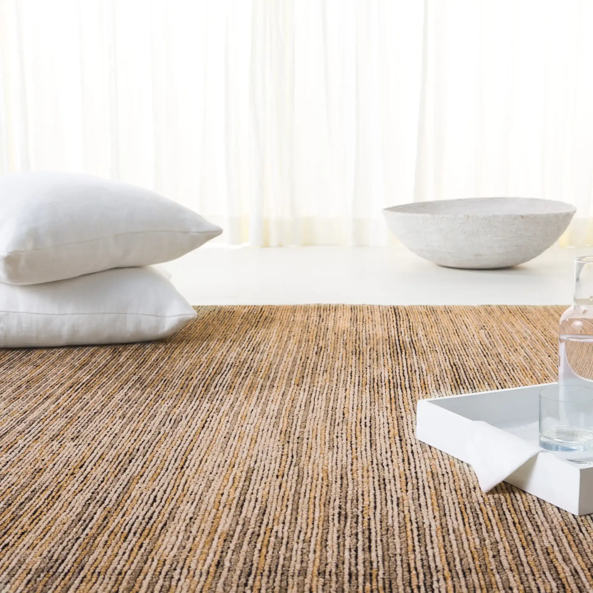 Izmir Striated Hand-Knotted Rug in Brown / Gray in a styled room