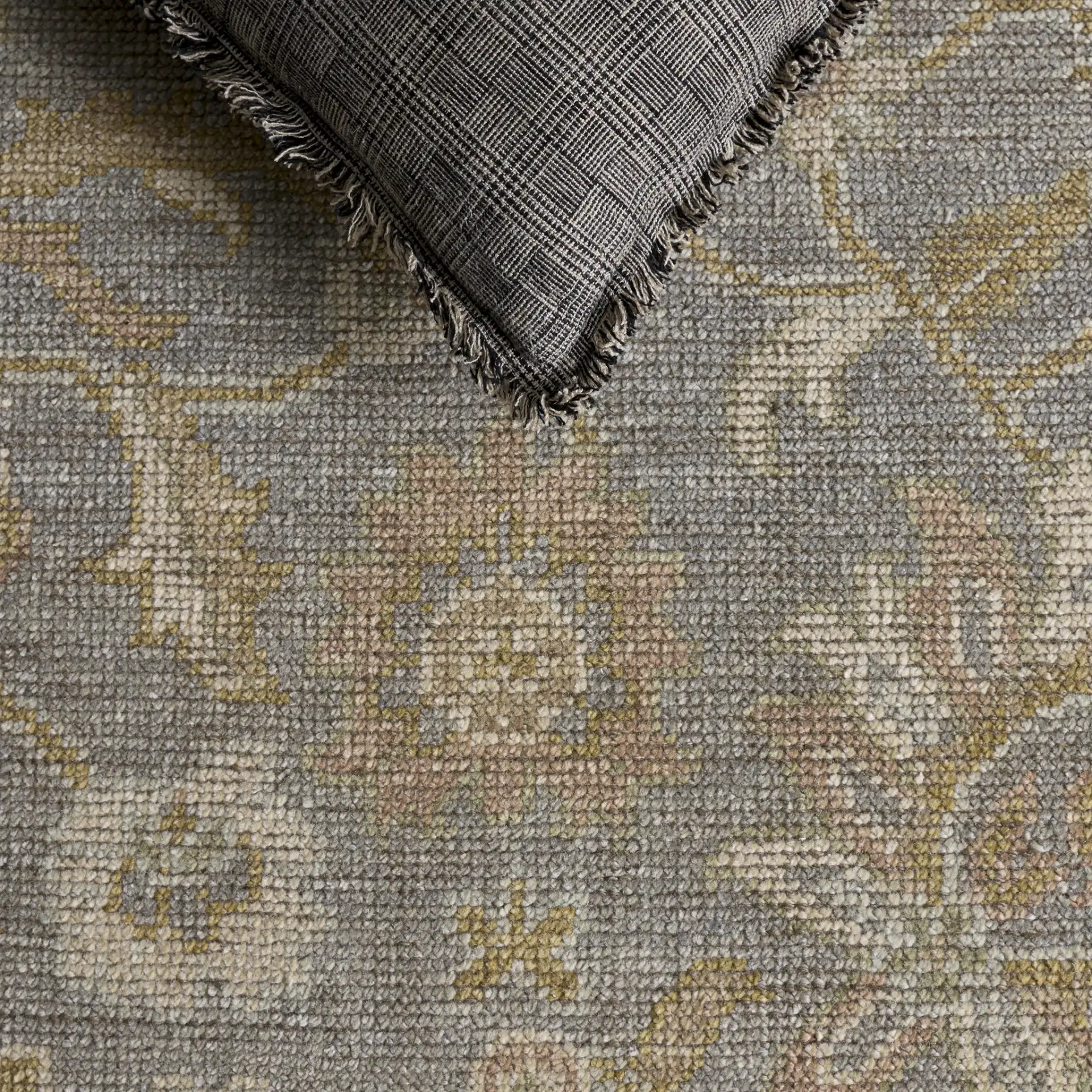 Izmir Floral Border Hand-Knotted Rug in Light Blue / Ivory in a styled room