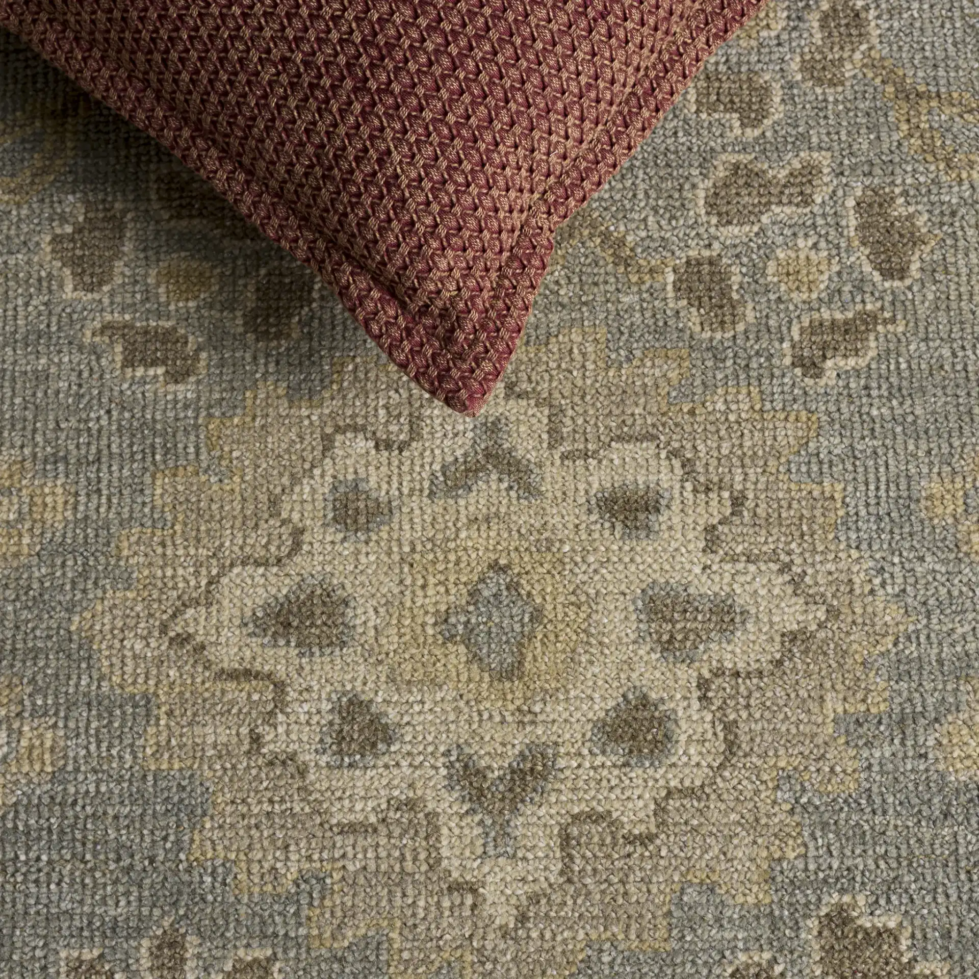 Izmir Floral Medallion Hand-Knotted Rug in Light Blue / Ivory in a styled room