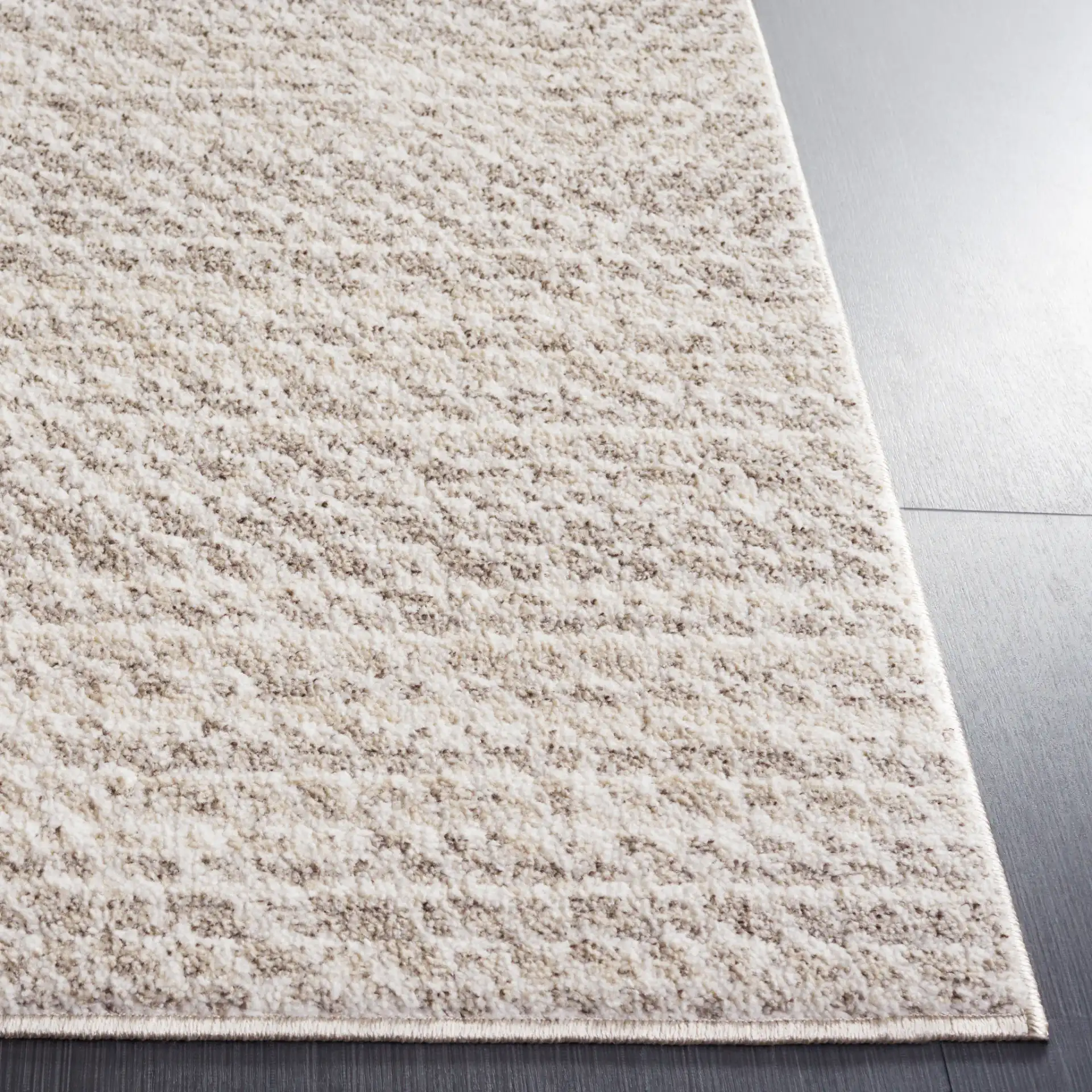 Jade Concentric Diamond Rug in Beige / Ivory in a styled room