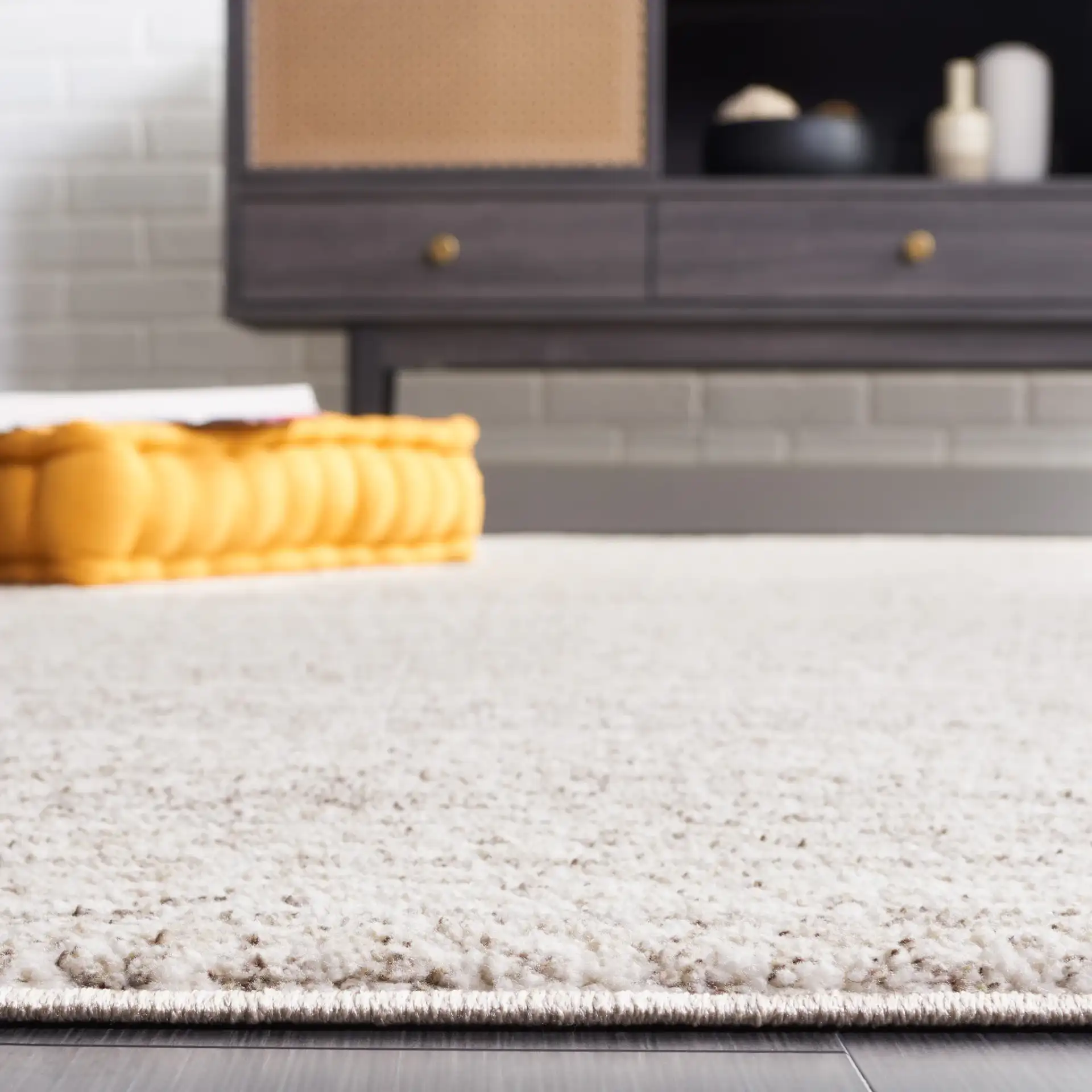 Jade Concentric Diamond Rug in Beige / Ivory in a styled room