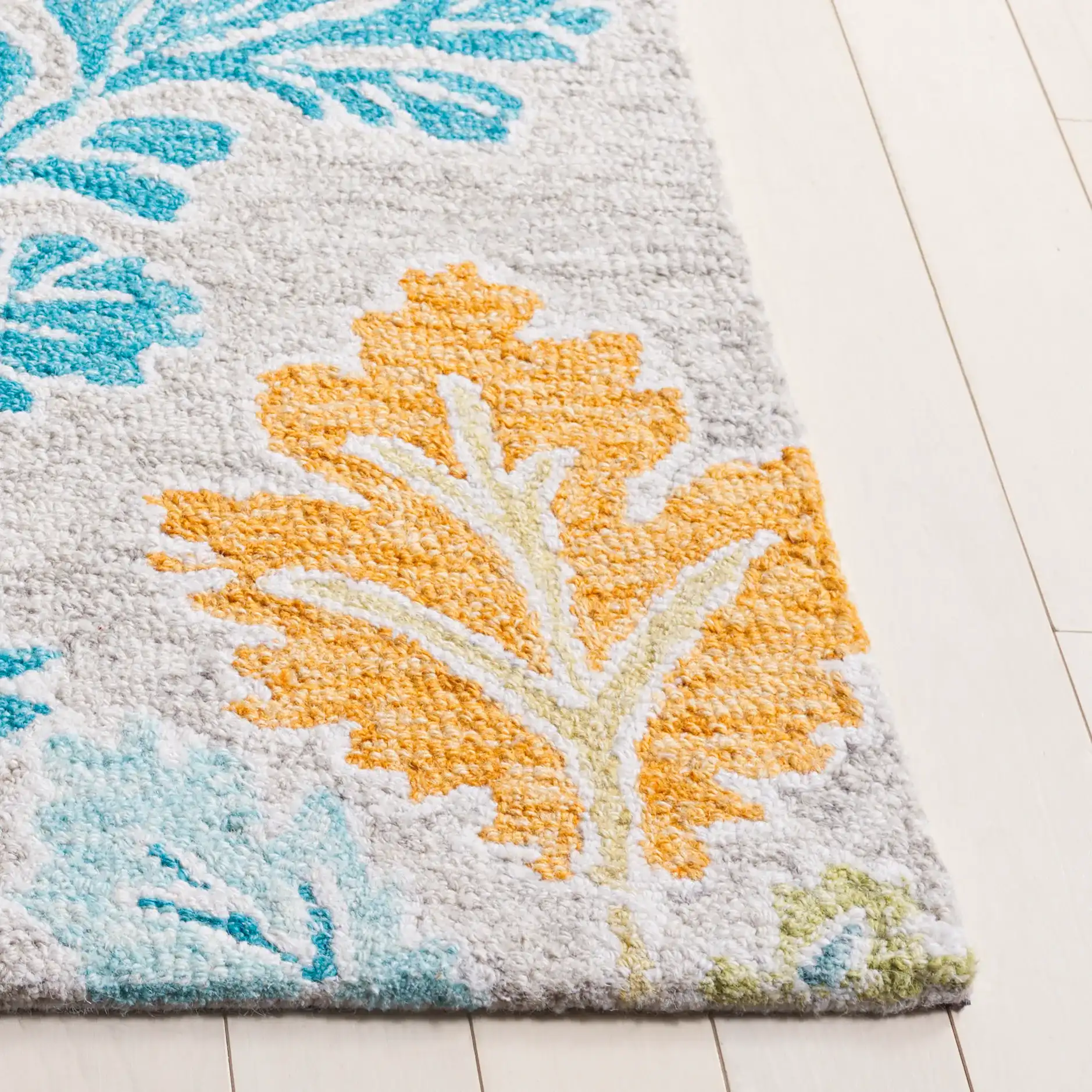 Jardin Oak Leaf Hand-Tufted Wool Rug in Blue / Gray in a styled room