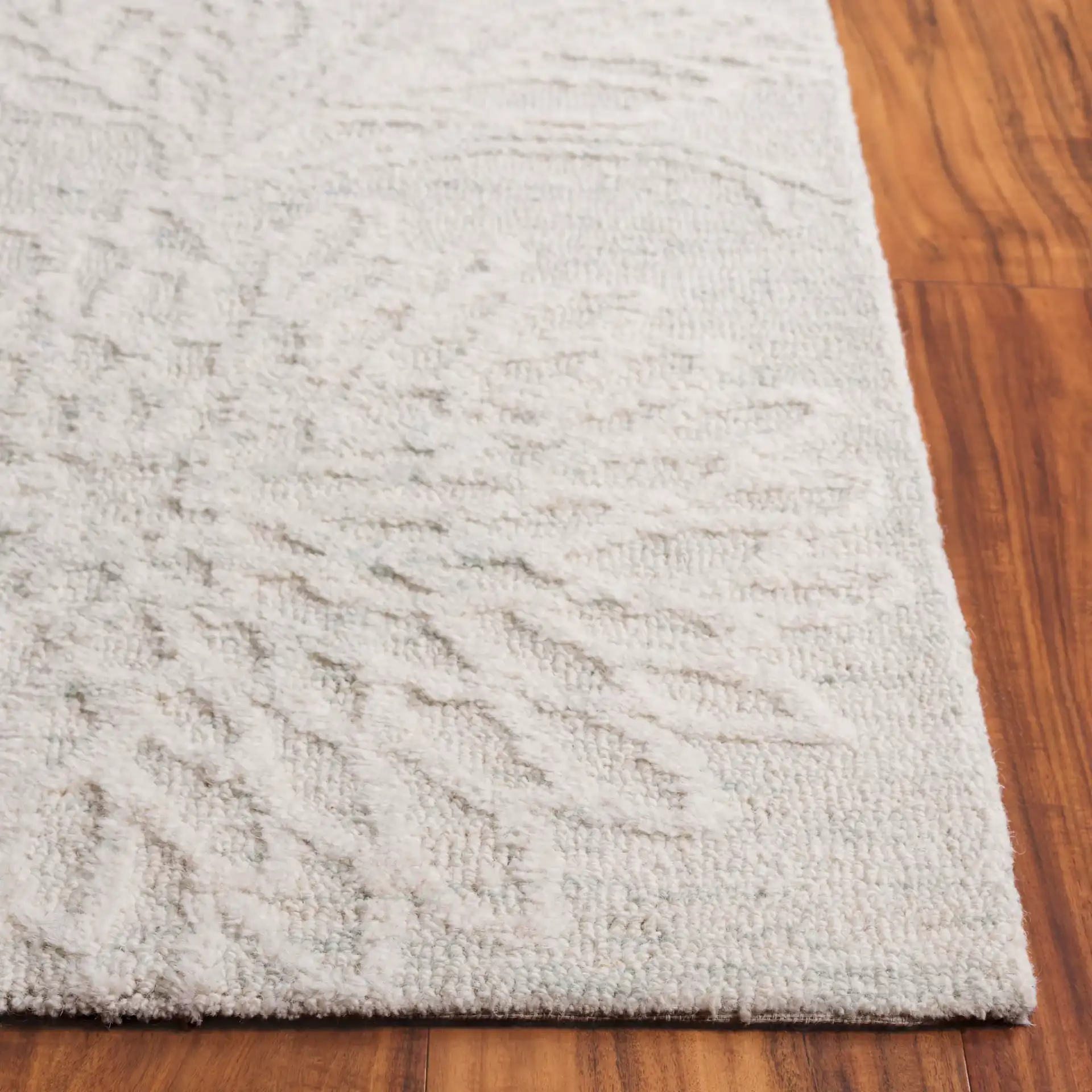 Jardin Chrysanthemum Floral Hand-Tufted Wool Rug in Light Teal / Ivory in a styled room
