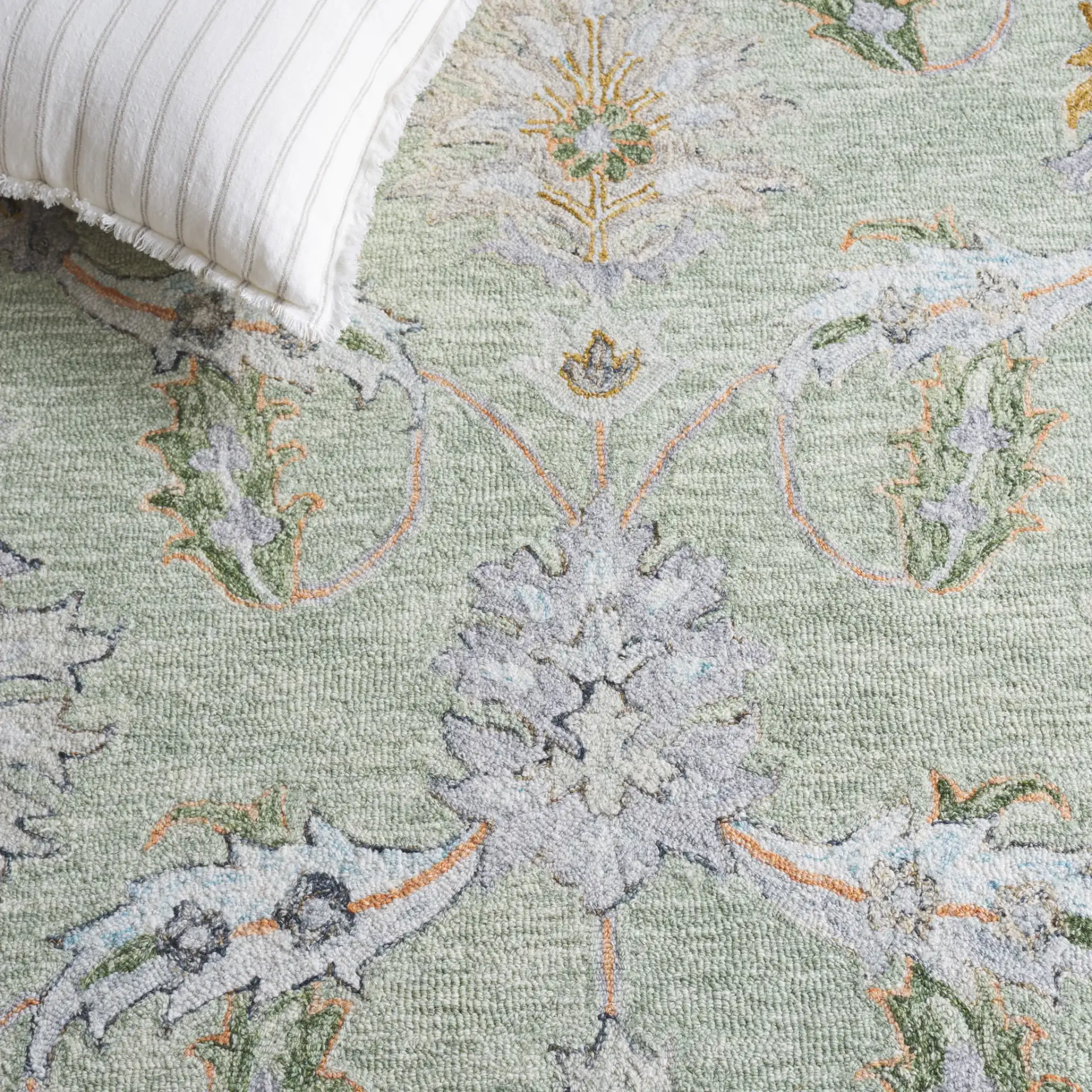 Jardin Allover Botanical Hand-Tufted Wool Rug in Sage / Green in a styled room