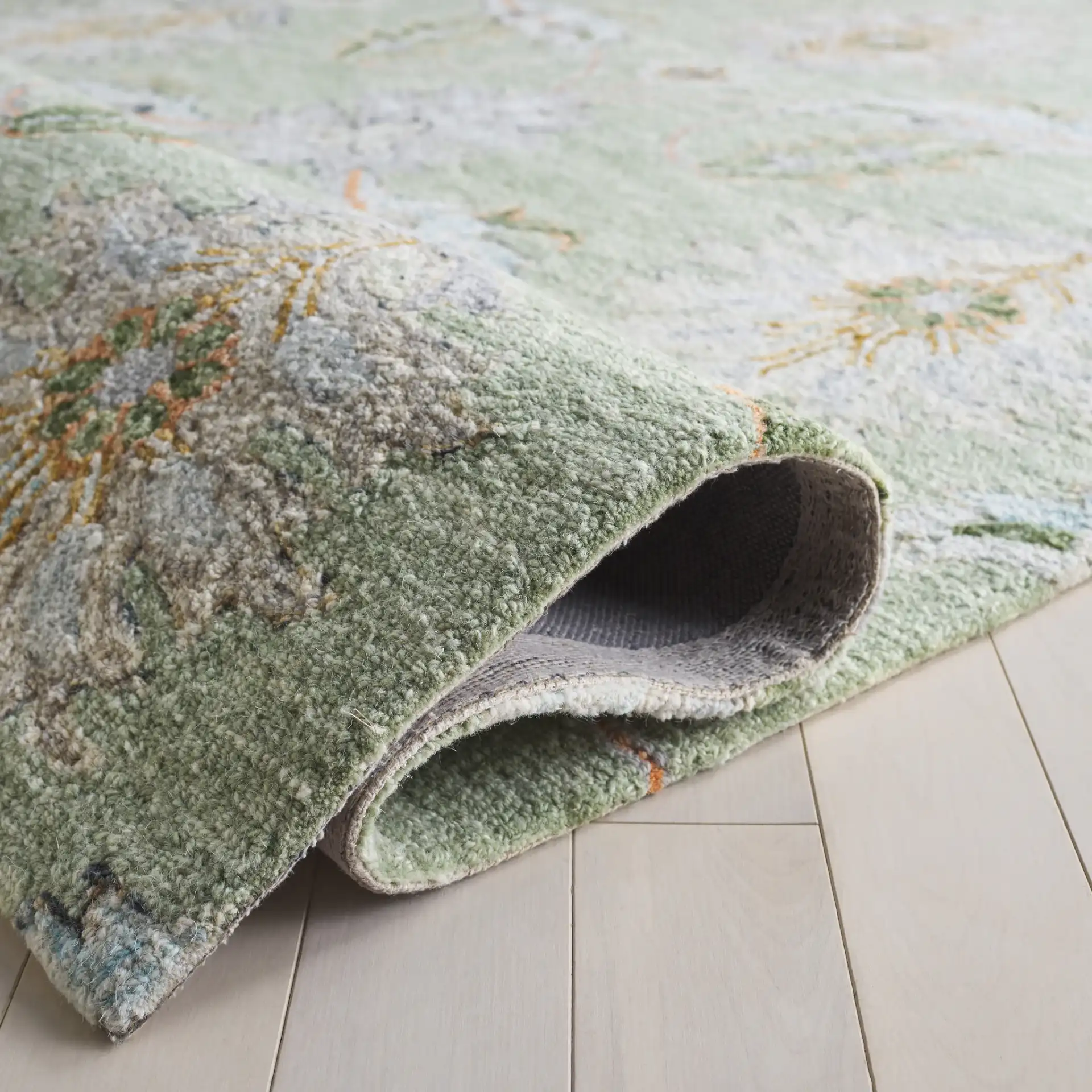 Jardin Allover Botanical Hand-Tufted Wool Rug in Sage / Green in a styled room