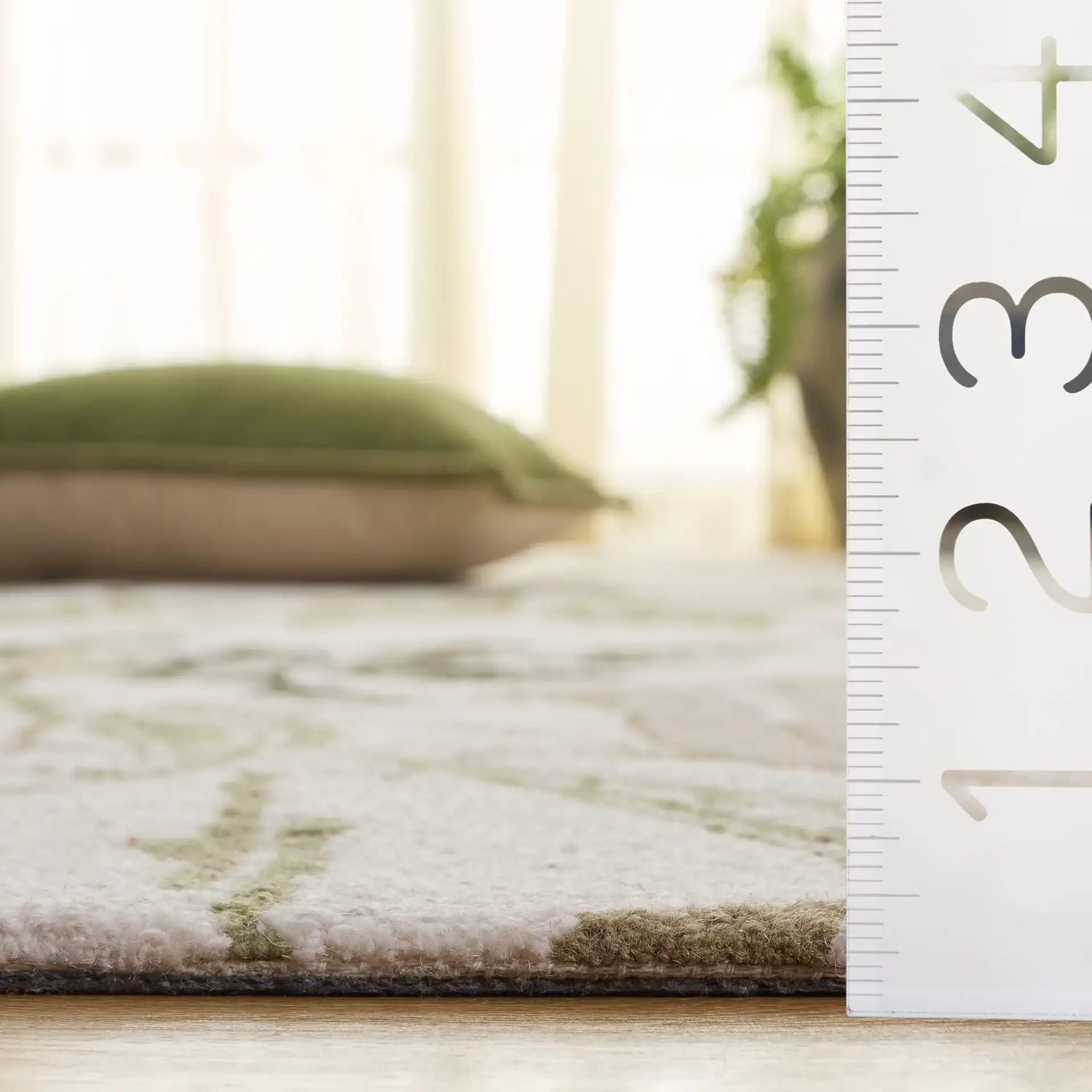 Jardin Botanical Vine Hand-Tufted Wool Rug in Ivory / Green in a styled room