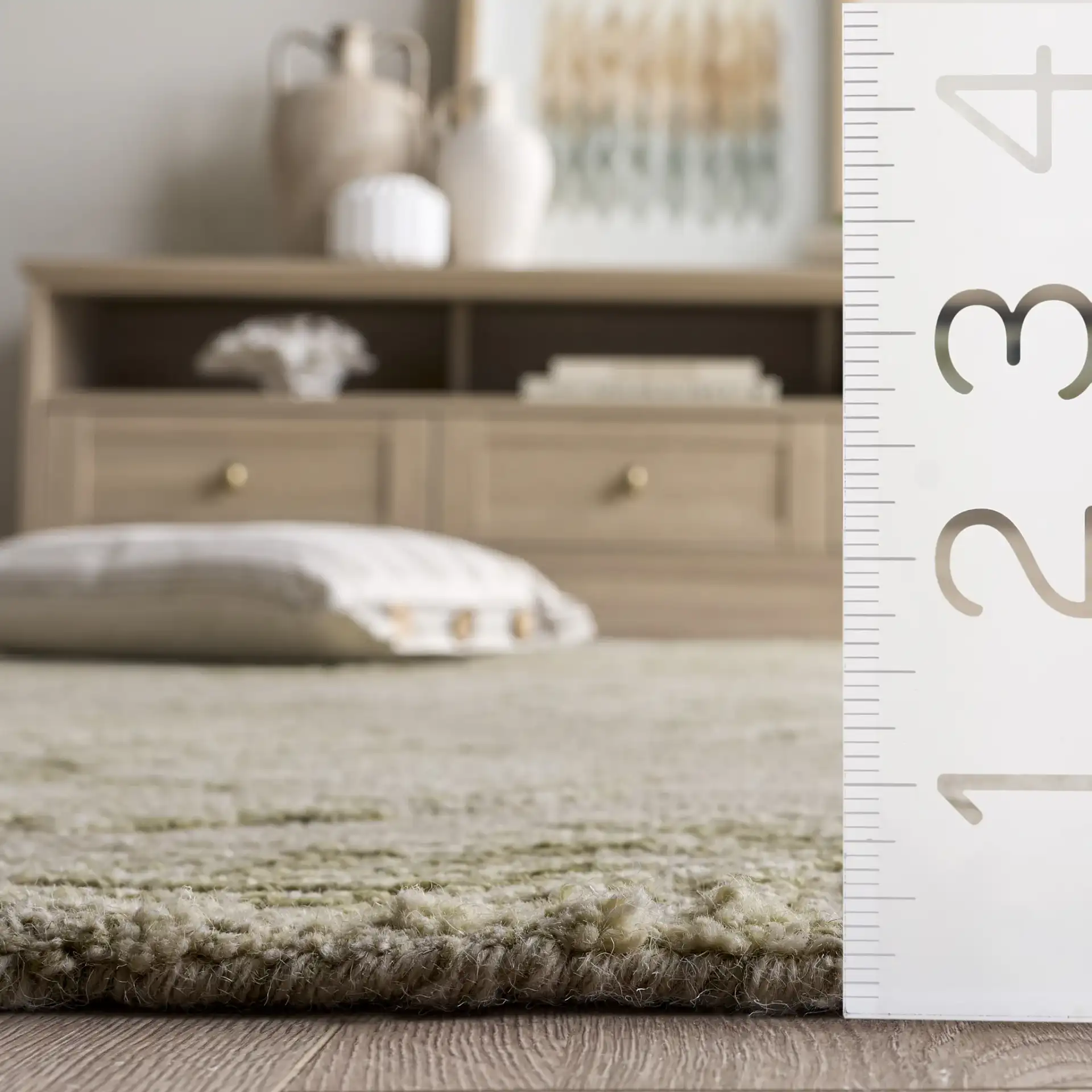 Jardin Palm Leaf Hand-Tufted Wool Rug in Sage / Ivory in a styled room