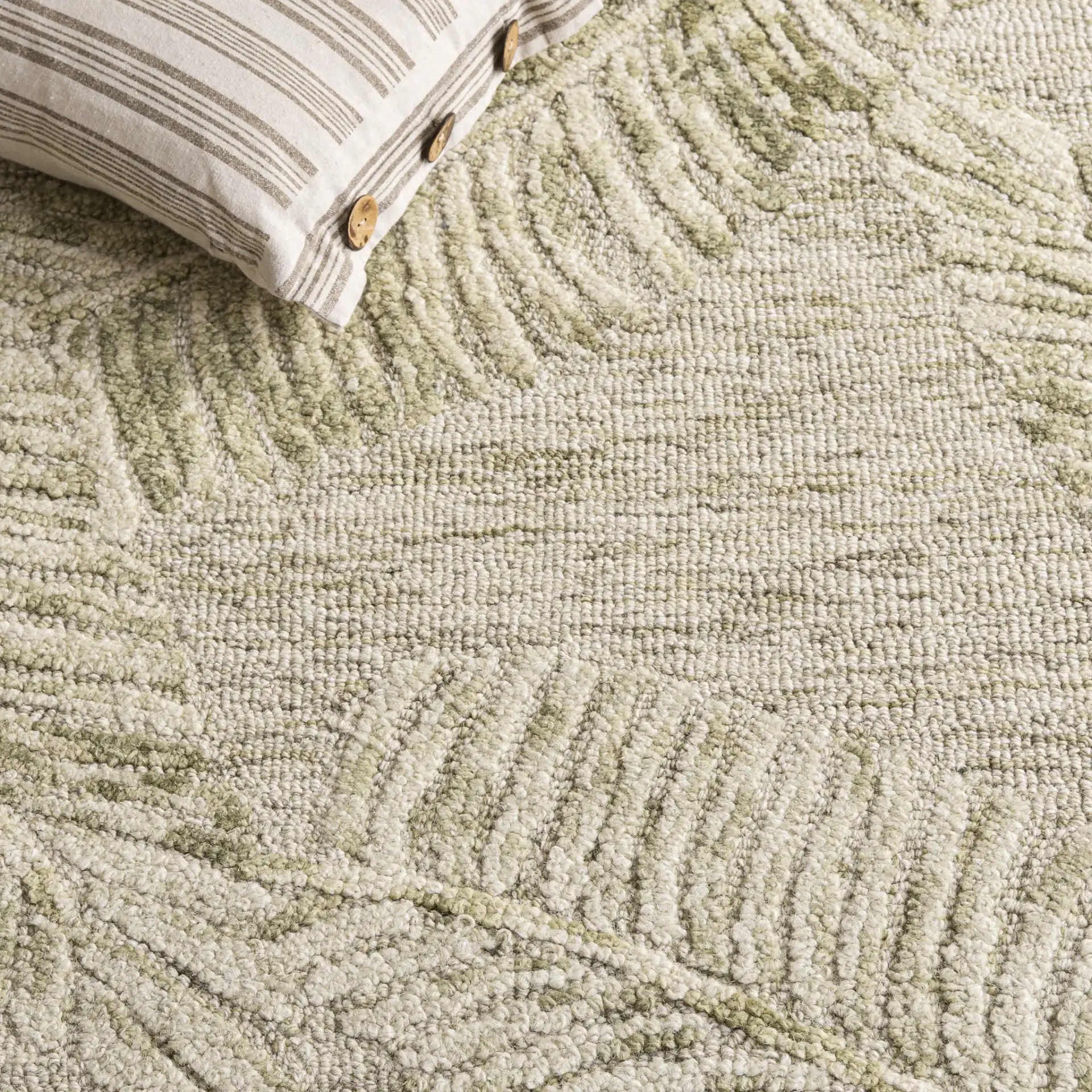 Jardin Palm Leaf Hand-Tufted Wool Rug in Sage / Ivory in a styled room